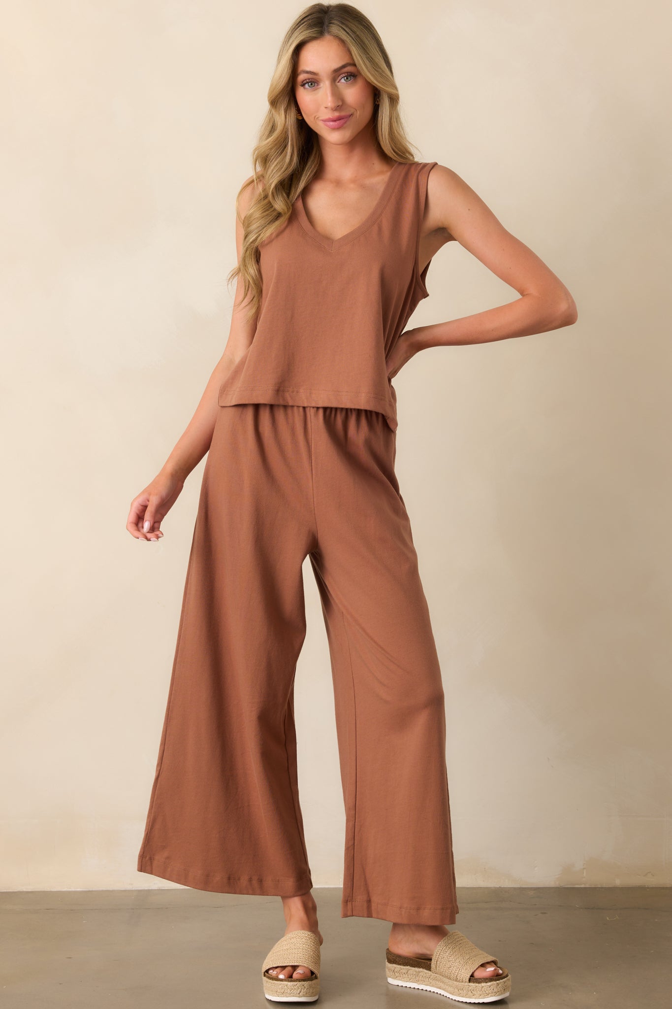 Brown cropped tank with clean lines, a flattering V-neck, and a sleeveless silhouette.
