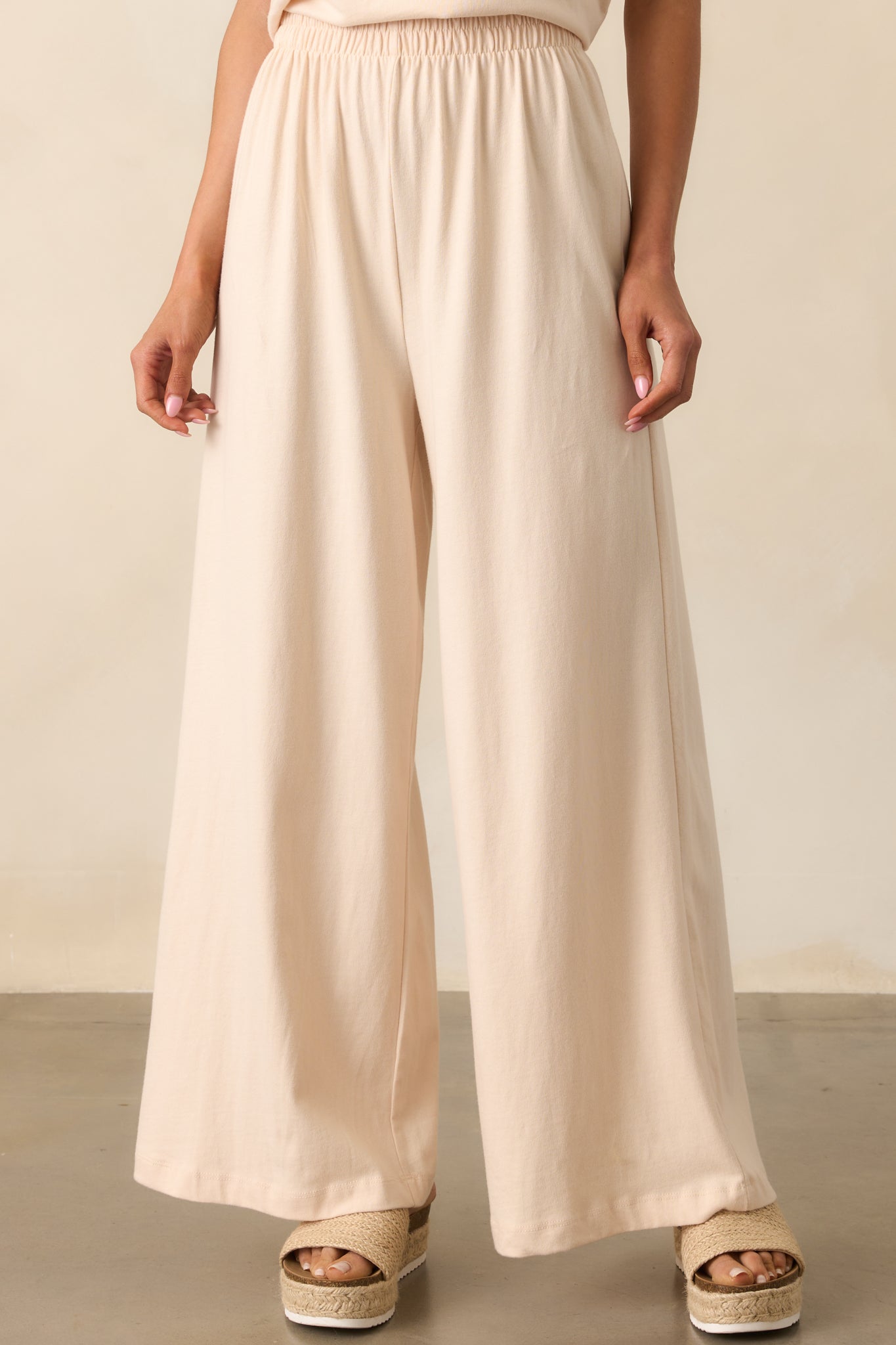 Cropped image highlighting the wide leg opening and natural movement of the cotton fabric.