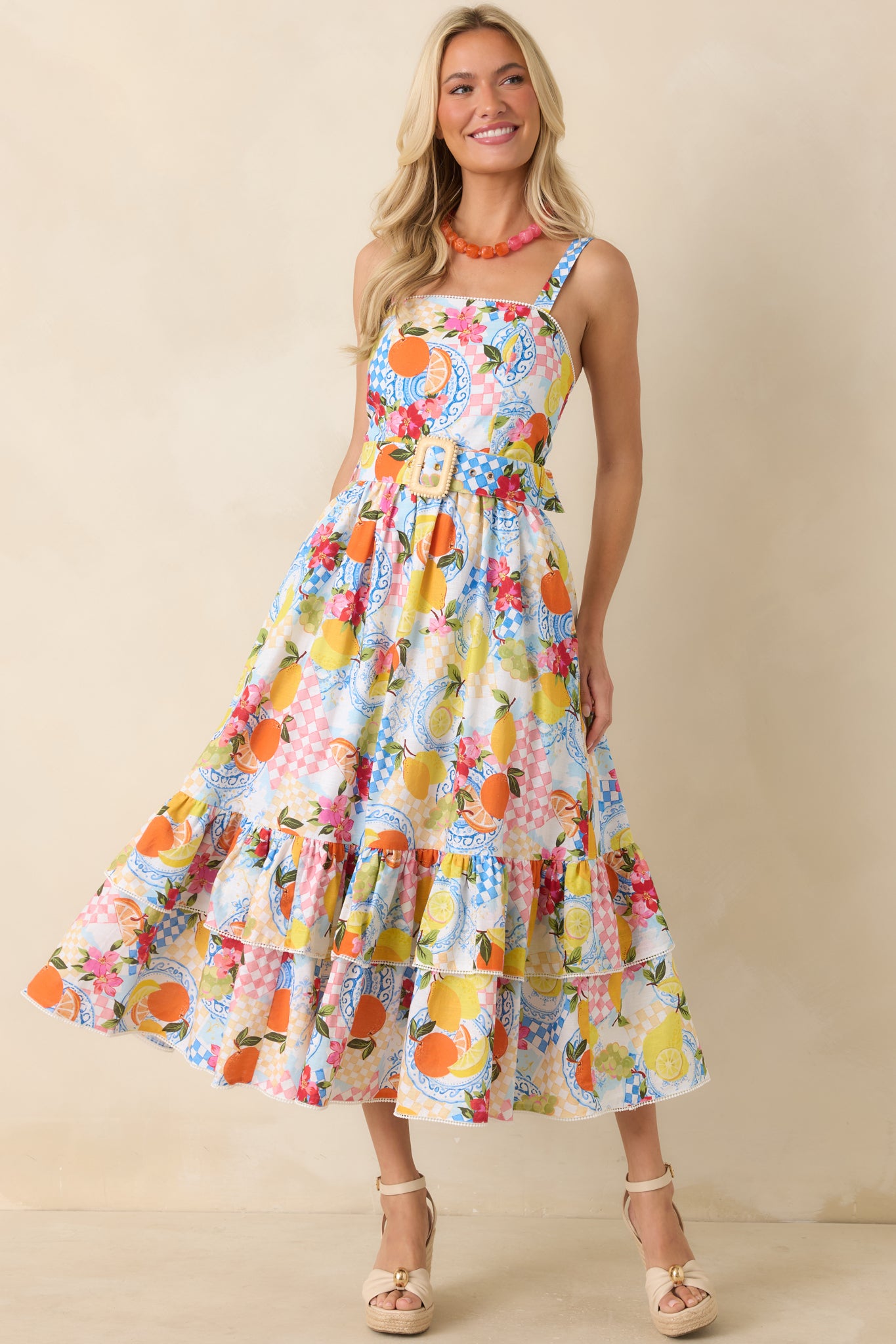 Midi dress showcasing a smocked back panel that creates flexible shaping while maintaining a smooth, tailored look in the citrus print fabric.