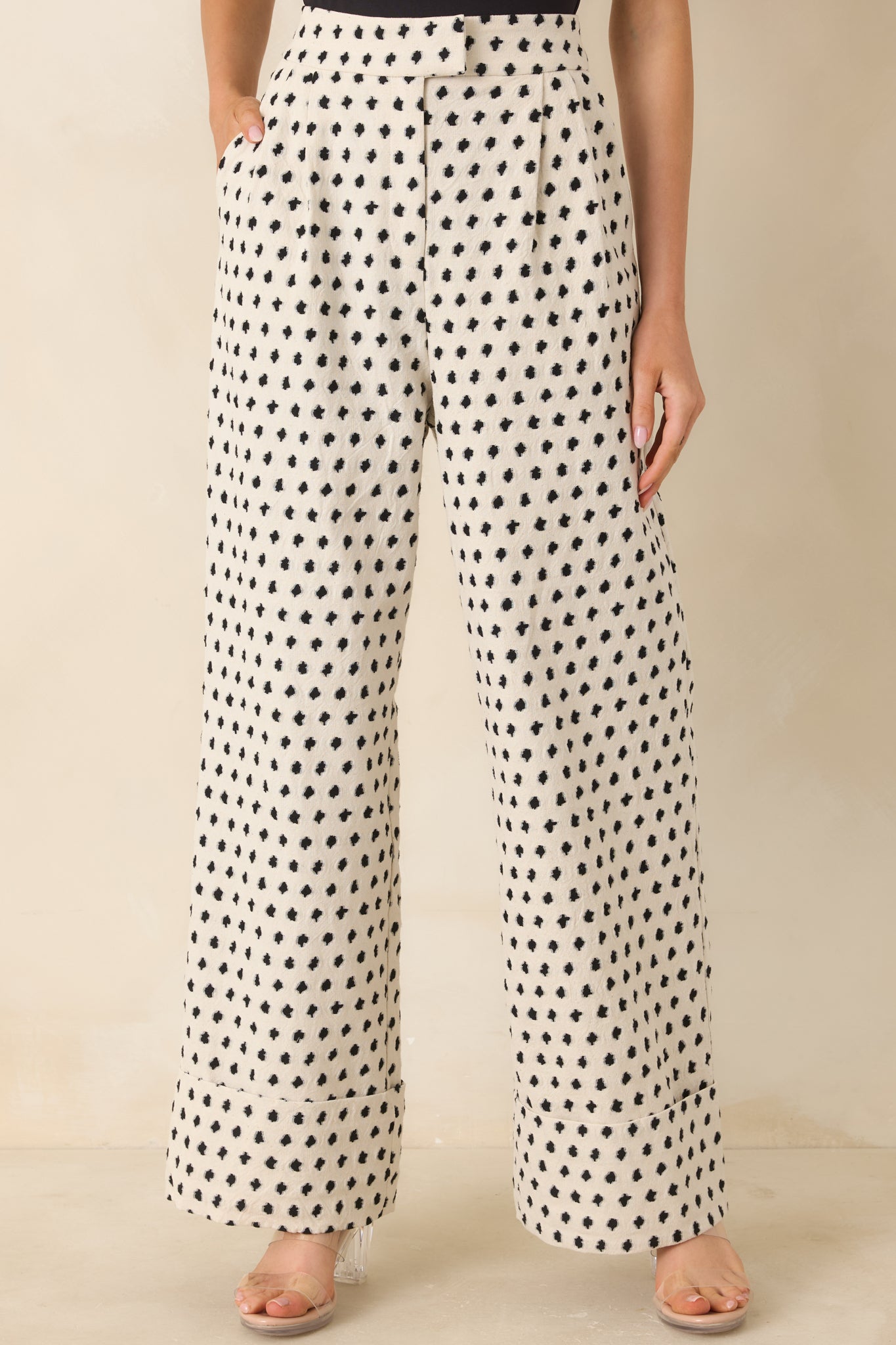 Side pocket detail on relaxed trousers with soft cotton-linen blend and subtle print.