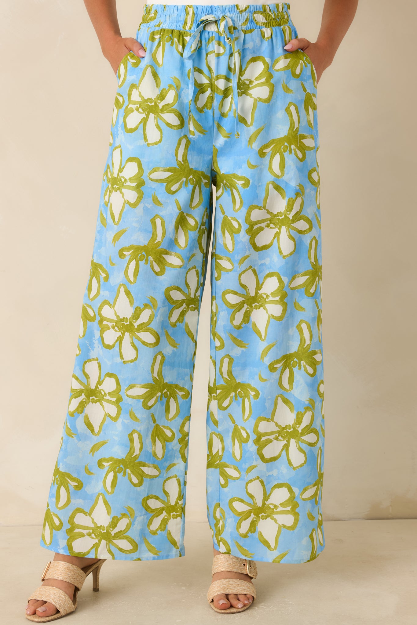 Detailed front-facing view showcasing the botanical print, relaxed fit, and soft movement of the wide leg design.