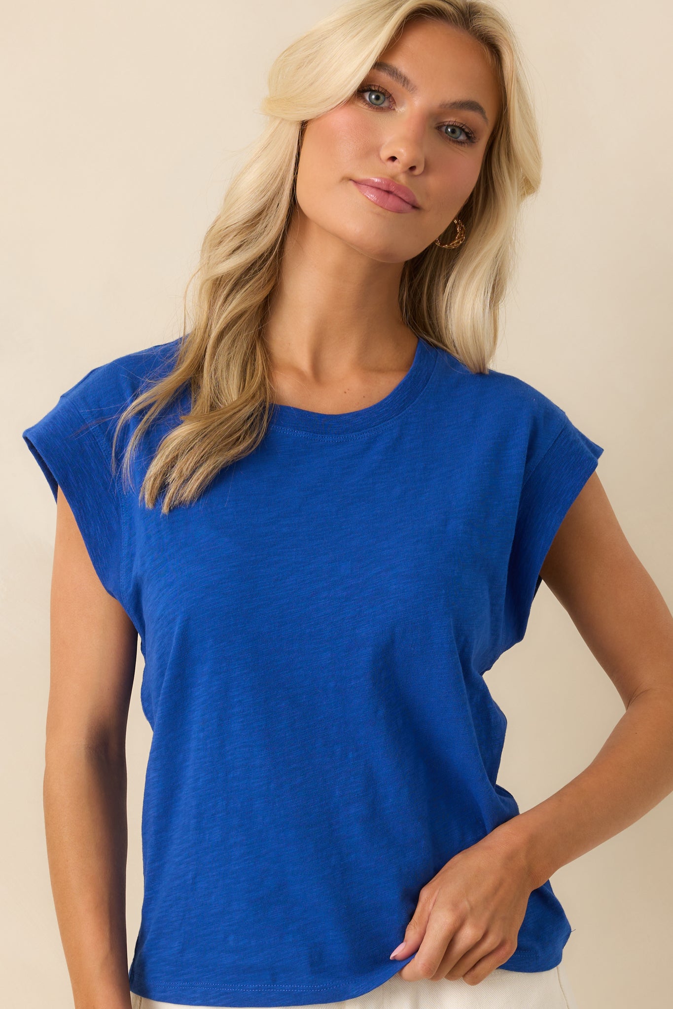 Cropped view highlighting the relaxed cut and soft structure of the top's upper section.