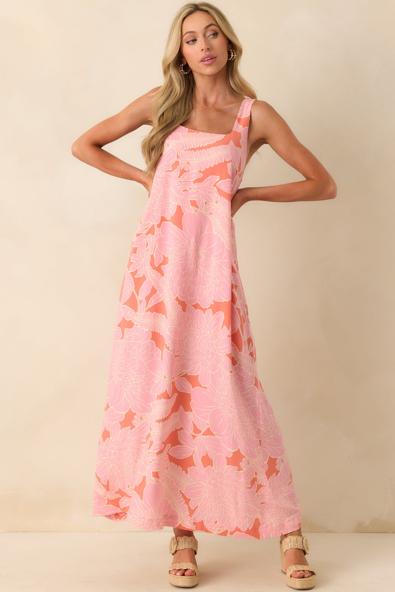 Full view of the pink coral maxi dress showing its square neckline and relaxed flowy silhouette.