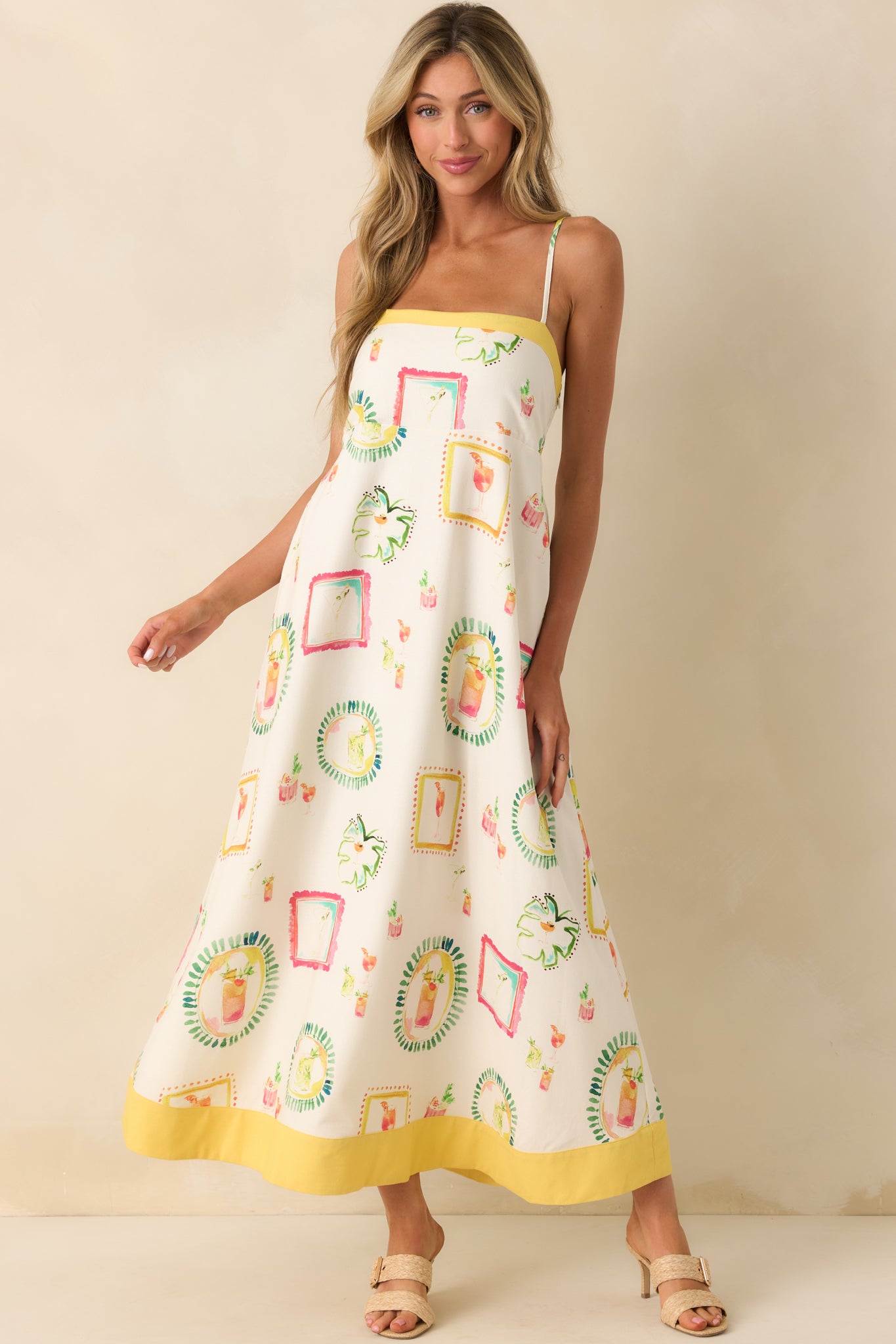Full body image highlighting the yellow trim detail along the hemline and the colorful multicolor print on the flowing skirt.