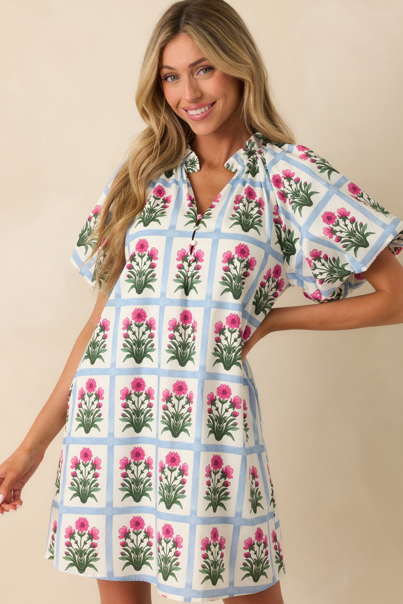 Cropped shot centered on the lower half of the dress showing one of the functional pockets and part of the ivory lining under the skirt.