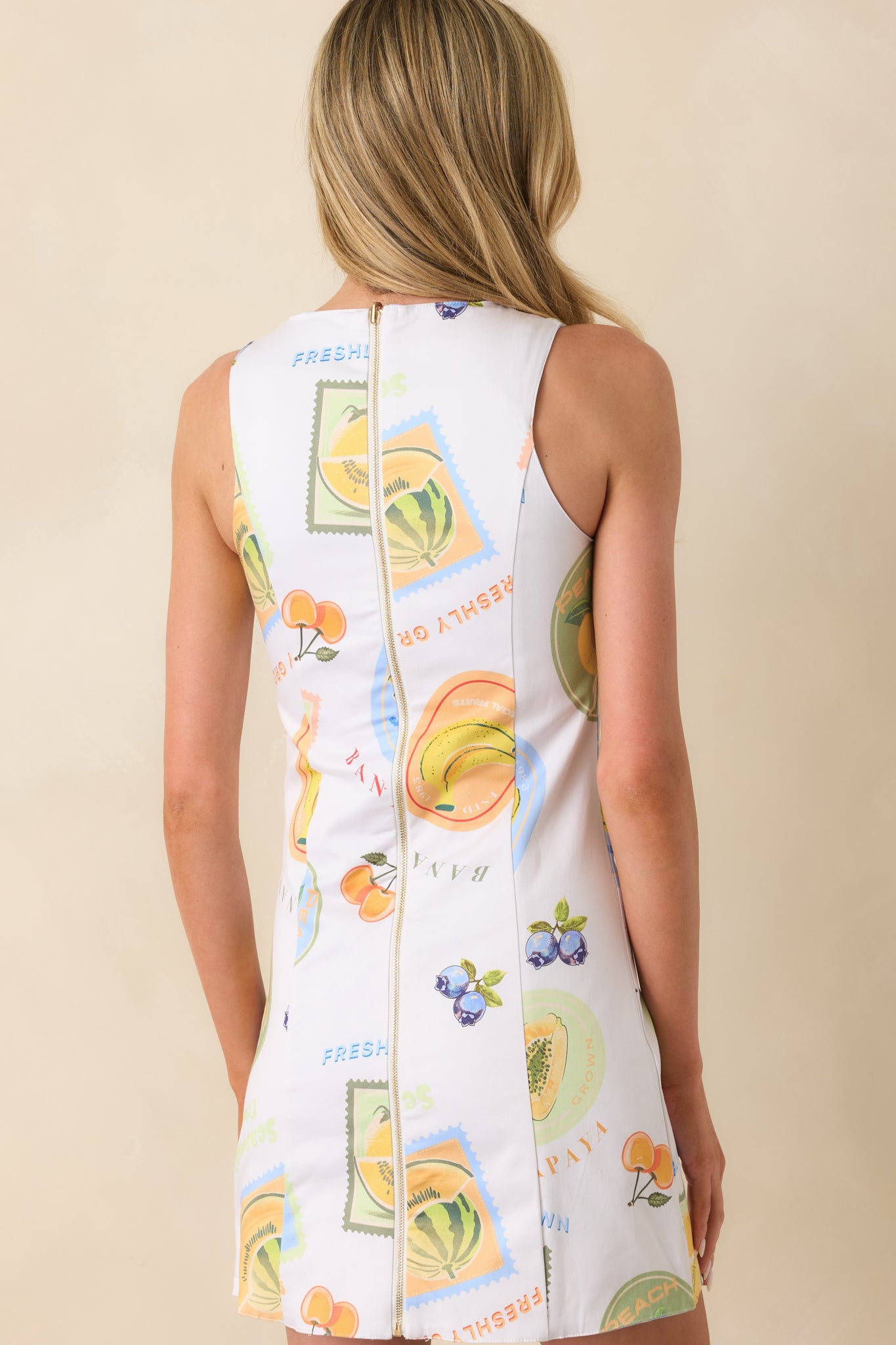 A view from behind of the patchwork side, showing the functional zipper and how the panel seams shape the structured mini silhouette.