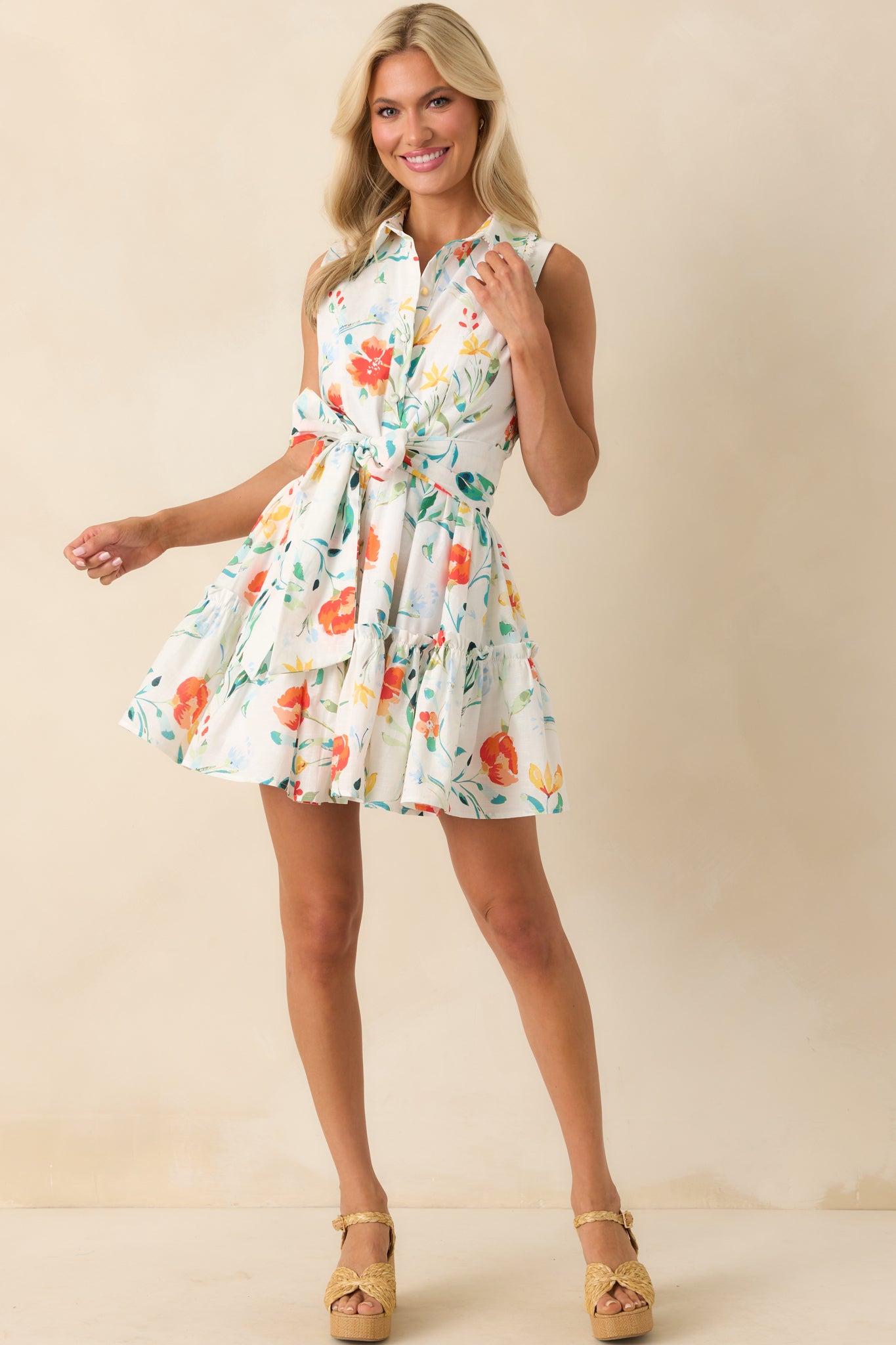 Ivory mini dress with Prosperina multicolor floral print, featuring a collared neckline and ruffle skirt detail in a full-length front view.