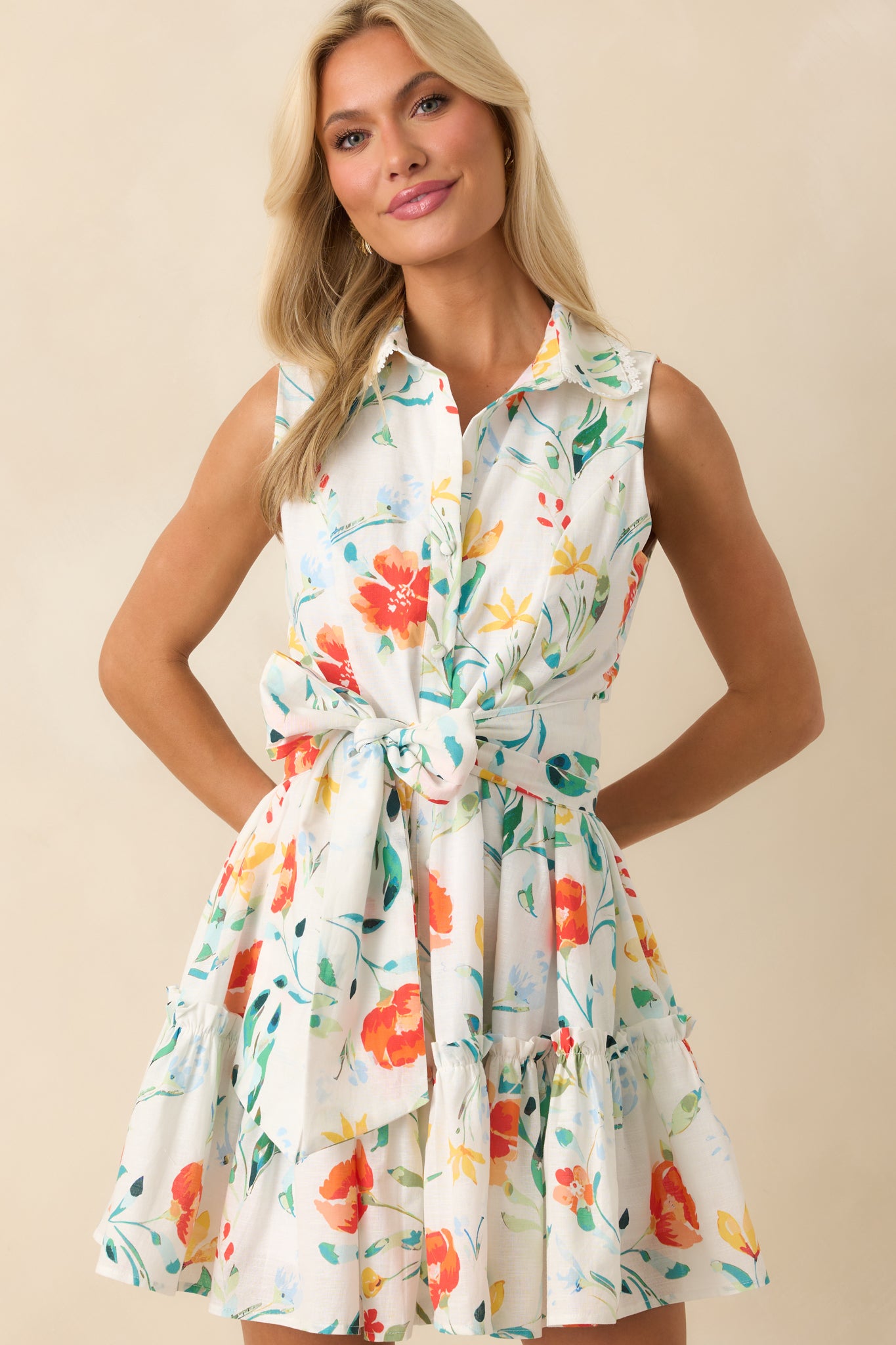 Close-up of the collar and upper bodice, emphasizing the floral print and delicate lace scallop trim detail.