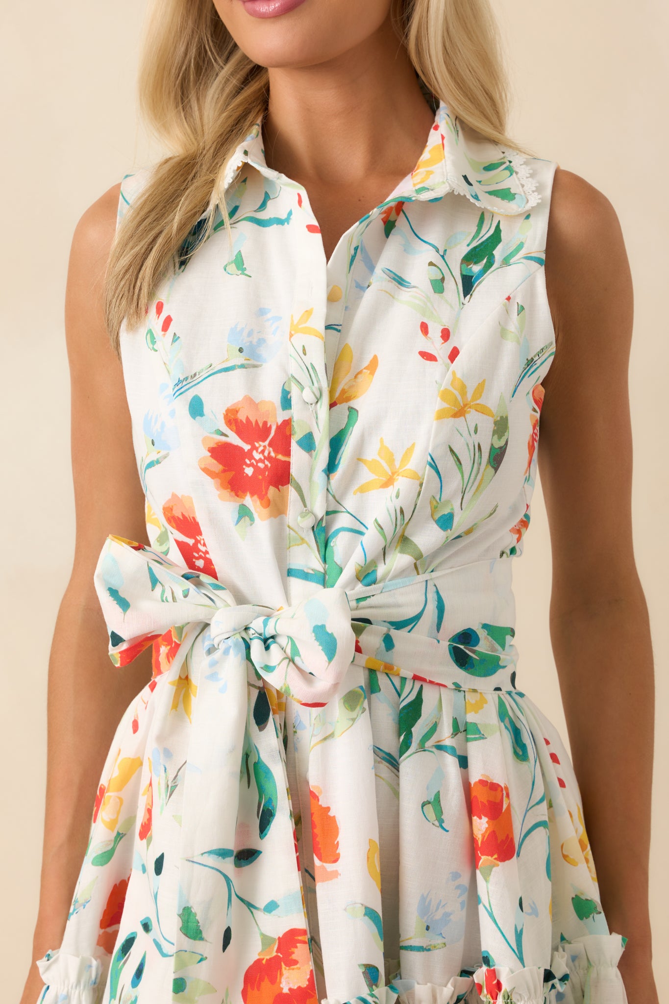 Extreme close-up of lace scallop trim and button detailing, revealing intricate embroidery and fabric quality.