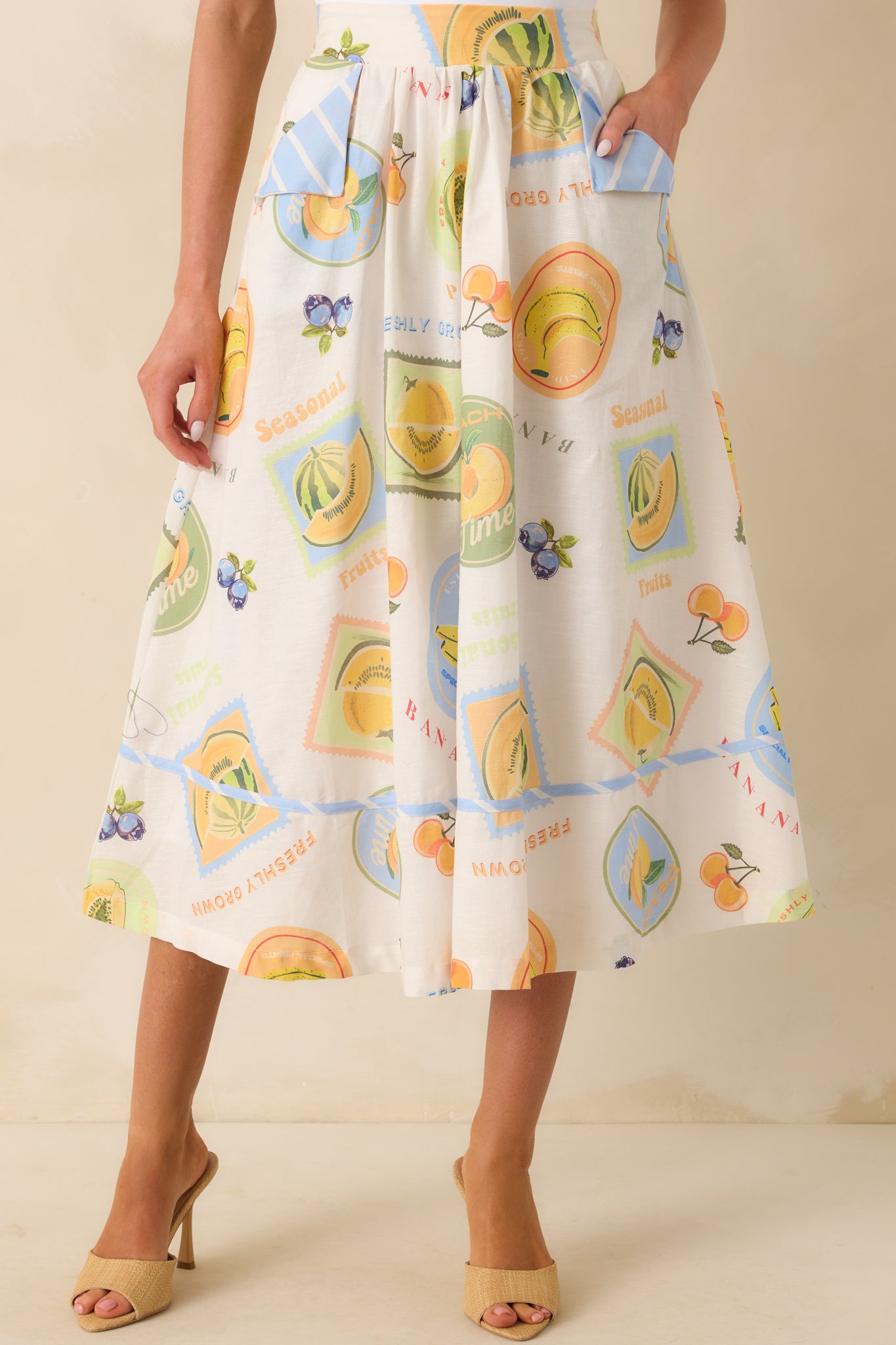 Focused view of the skirt’s front panel, showcasing patchwork print and one decorative striped pocket flap.