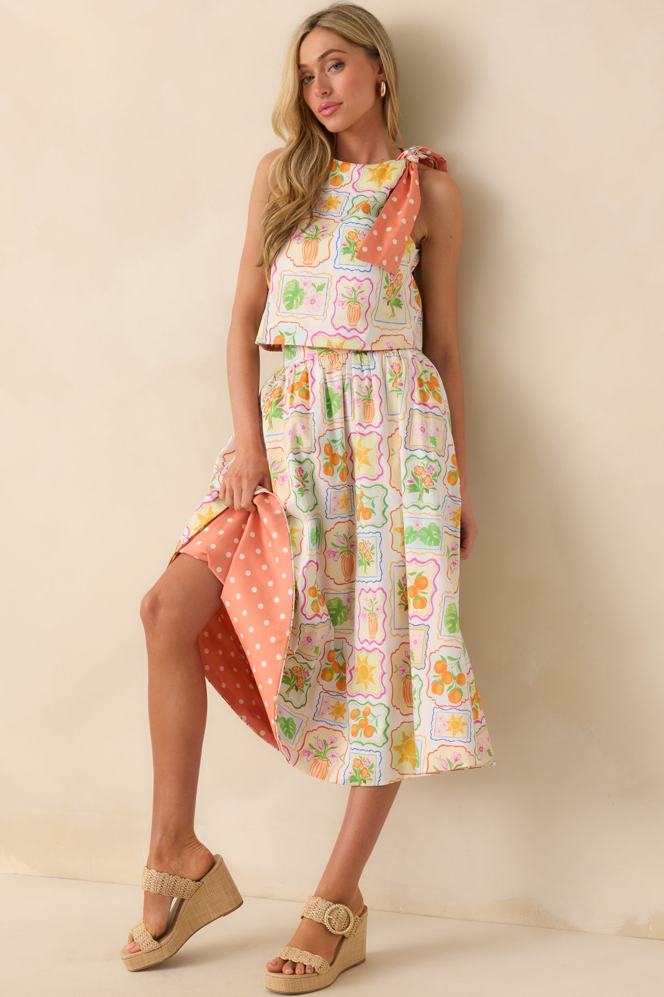 Reversible midi skirt in Prosperina peach patchwork print, showing relaxed fit and elastic back waist.