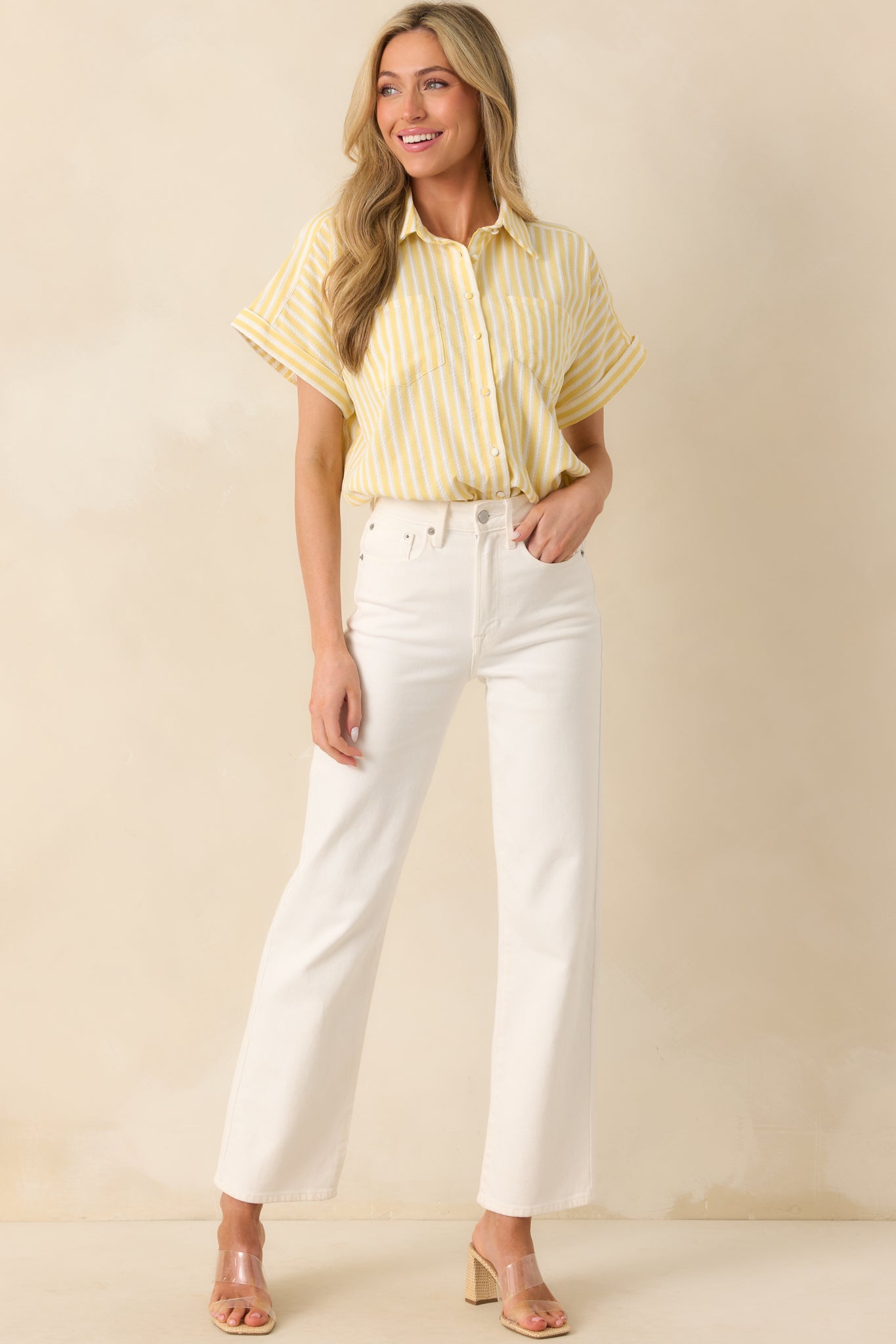 Casual striped top with side vent slits and stitch detailing throughout, styled with a laid-back silhouette in full view.