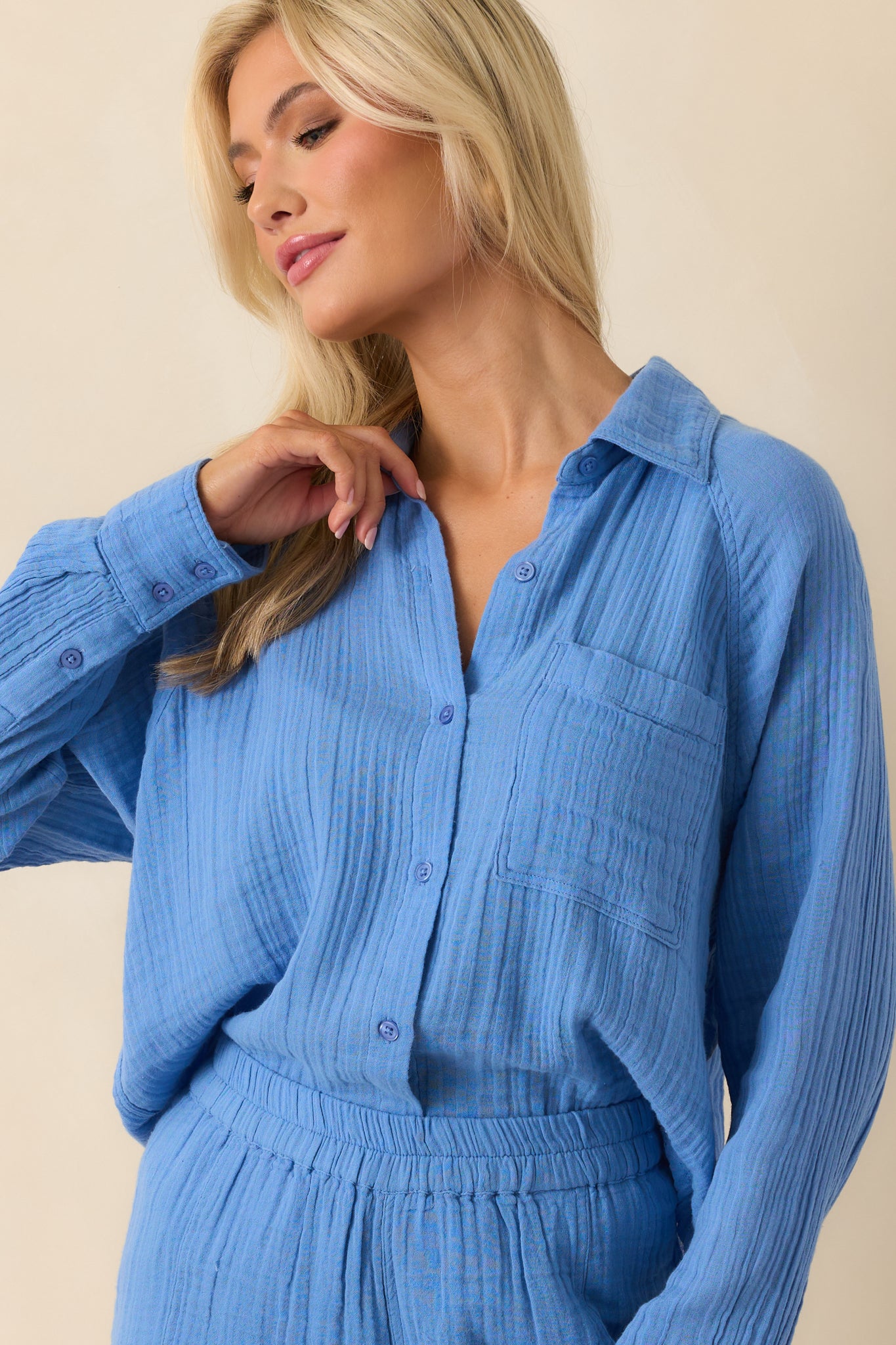 Blue cotton gauze top shown from the front, highlighting the collared neckline and relaxed fit.