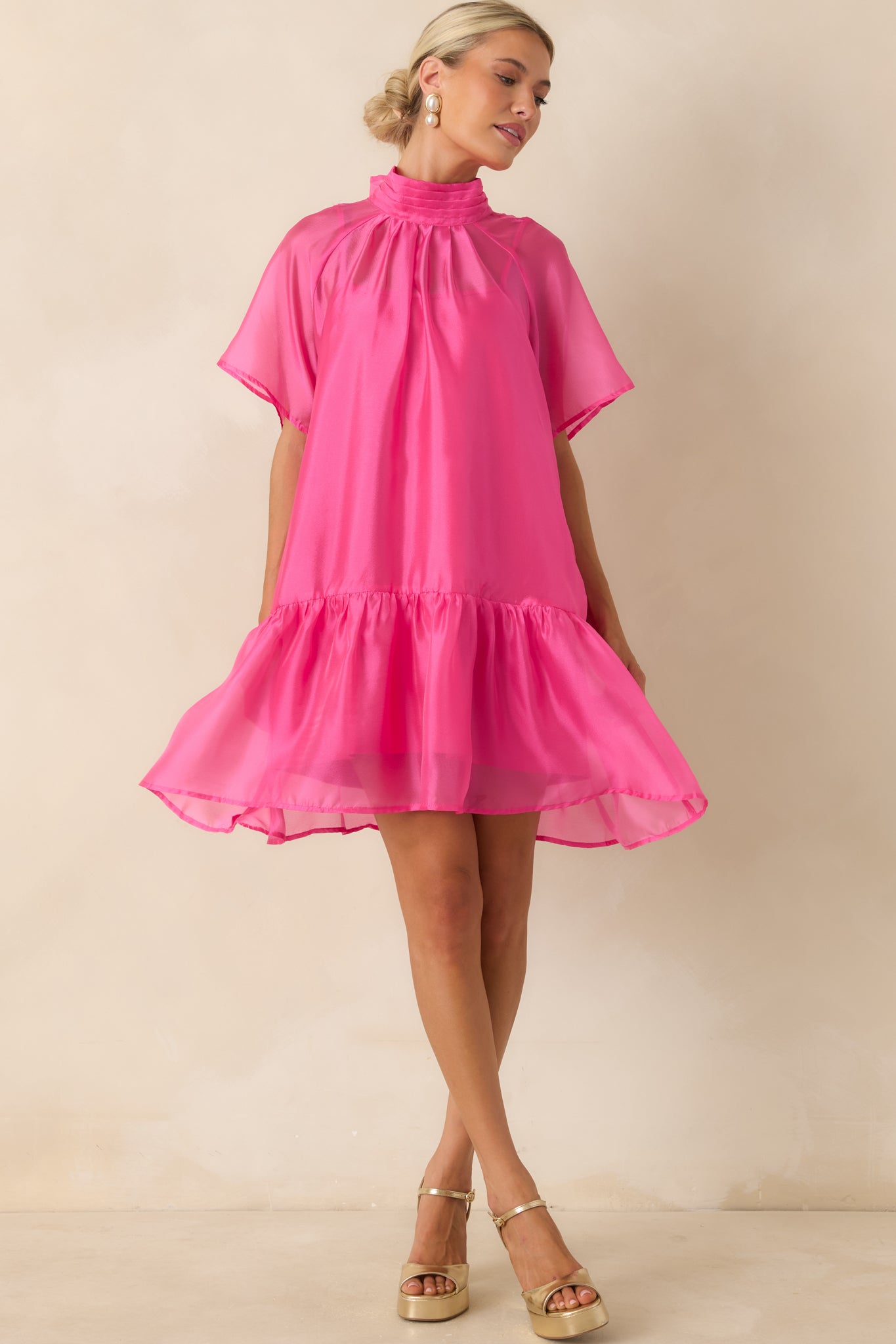 Lightweight organza mini dress showcasing a ruffled hem and fully lined body for soft structure and coverage.