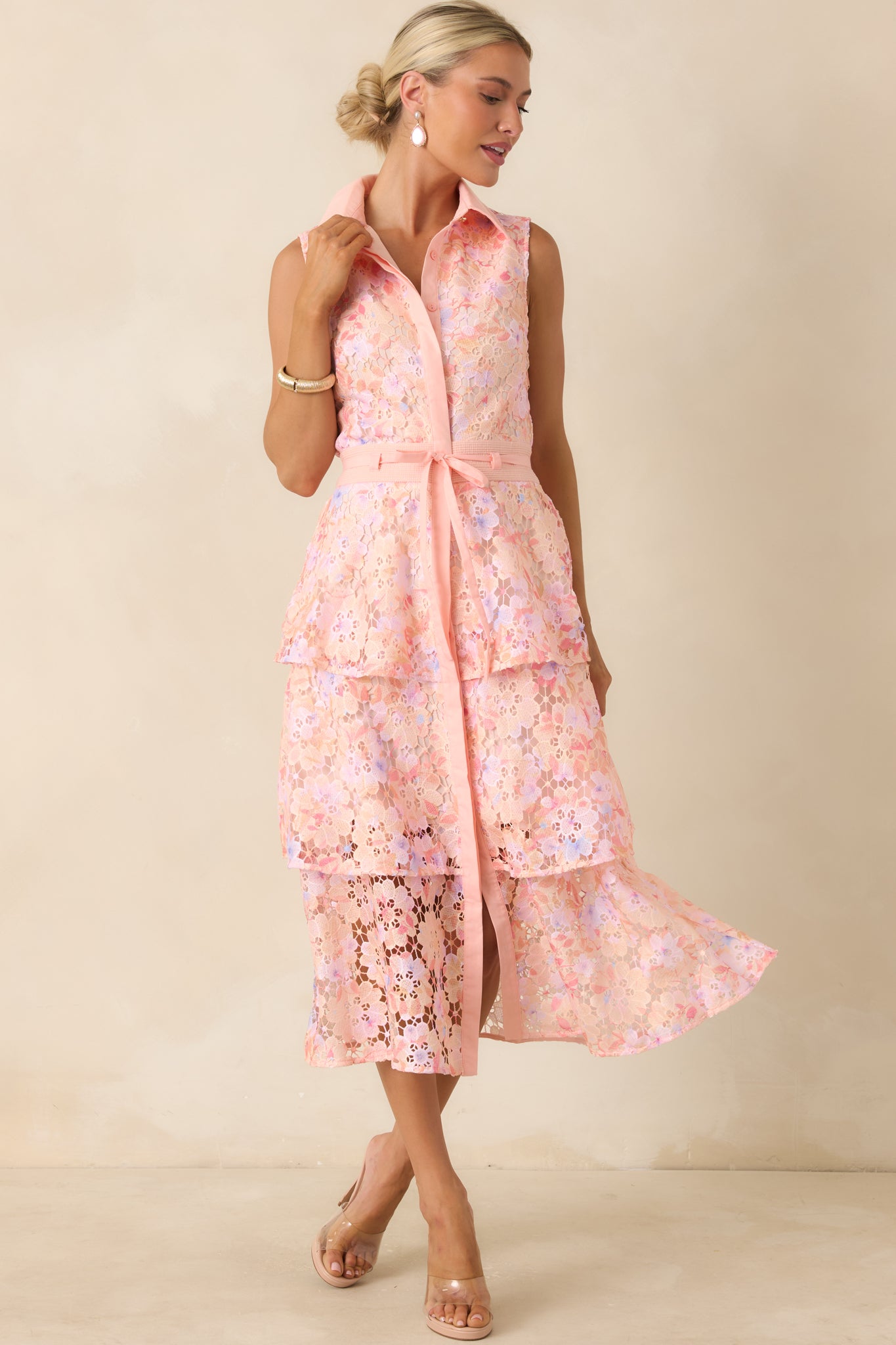Pink floral lace midi dress featuring a collared neckline, sleeveless design, and functional front button closure.