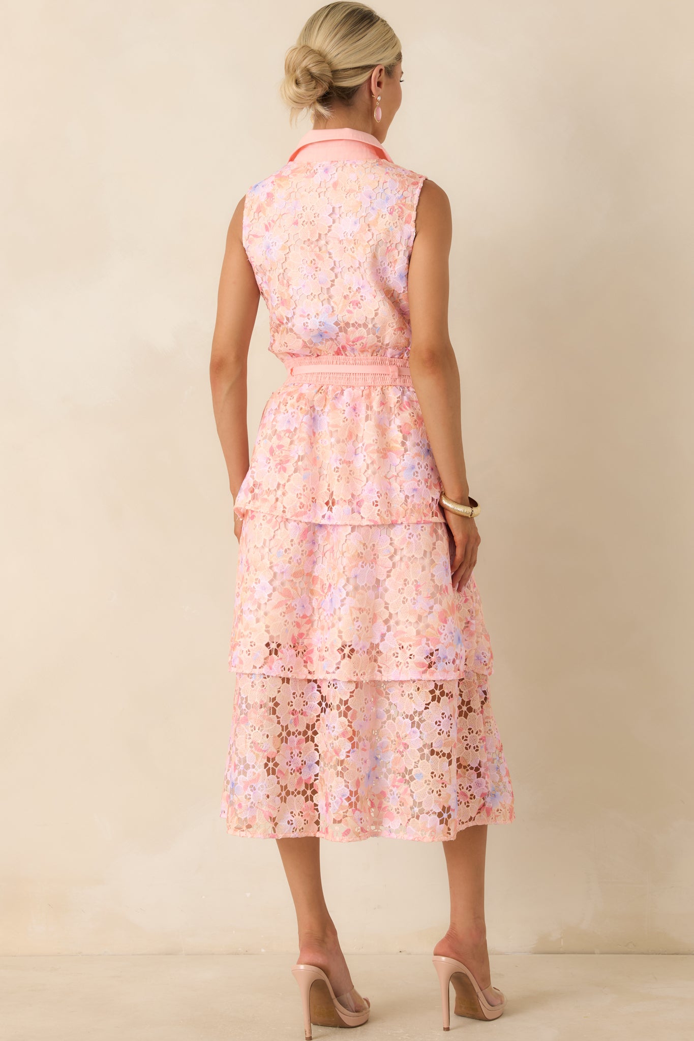 Rear view of the pink floral lace midi dress featuring a sleeveless cut, collared neckline continuation, and clean tailored finish.