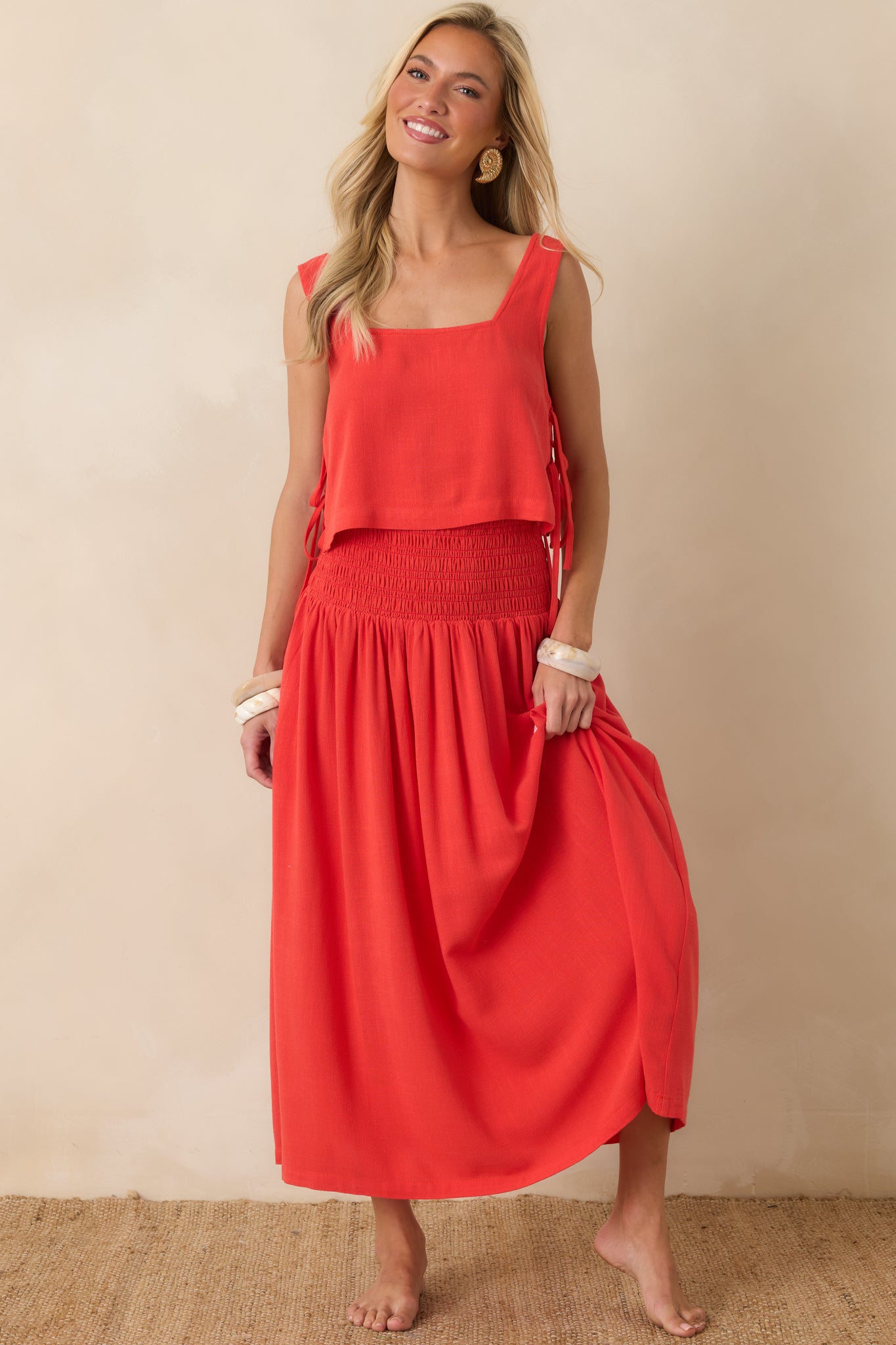 Sangria crop top featuring a square neckline, wide shoulder straps, and double side tie details for an airy, relaxed silhouette.