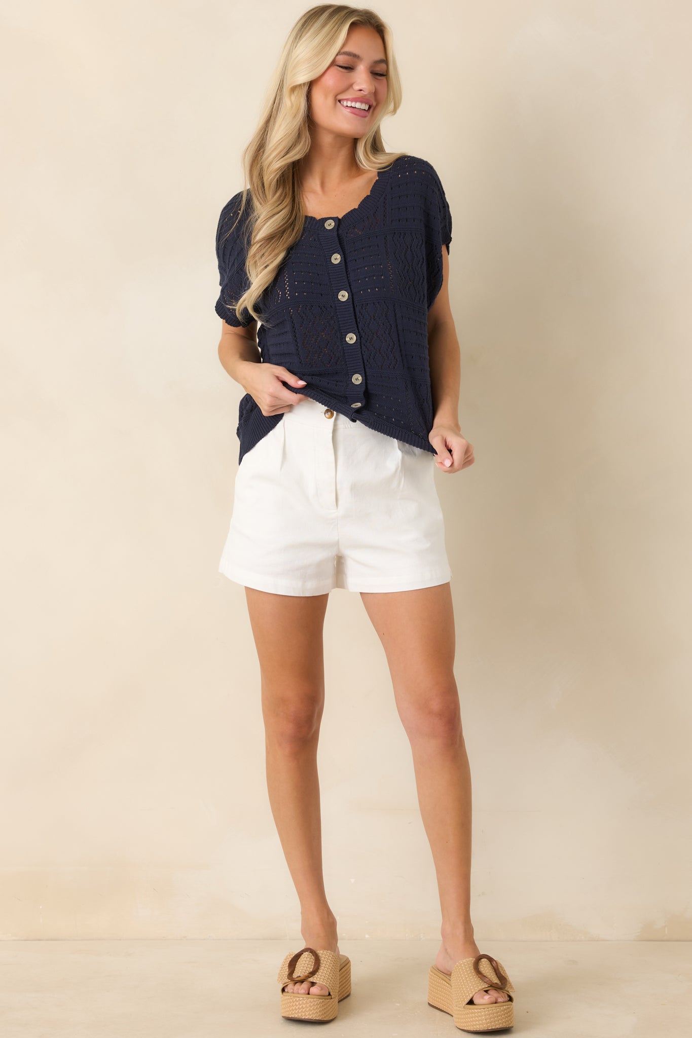 Button-front cardigan with collared neckline and relaxed open-knit construction for a breezy finish.