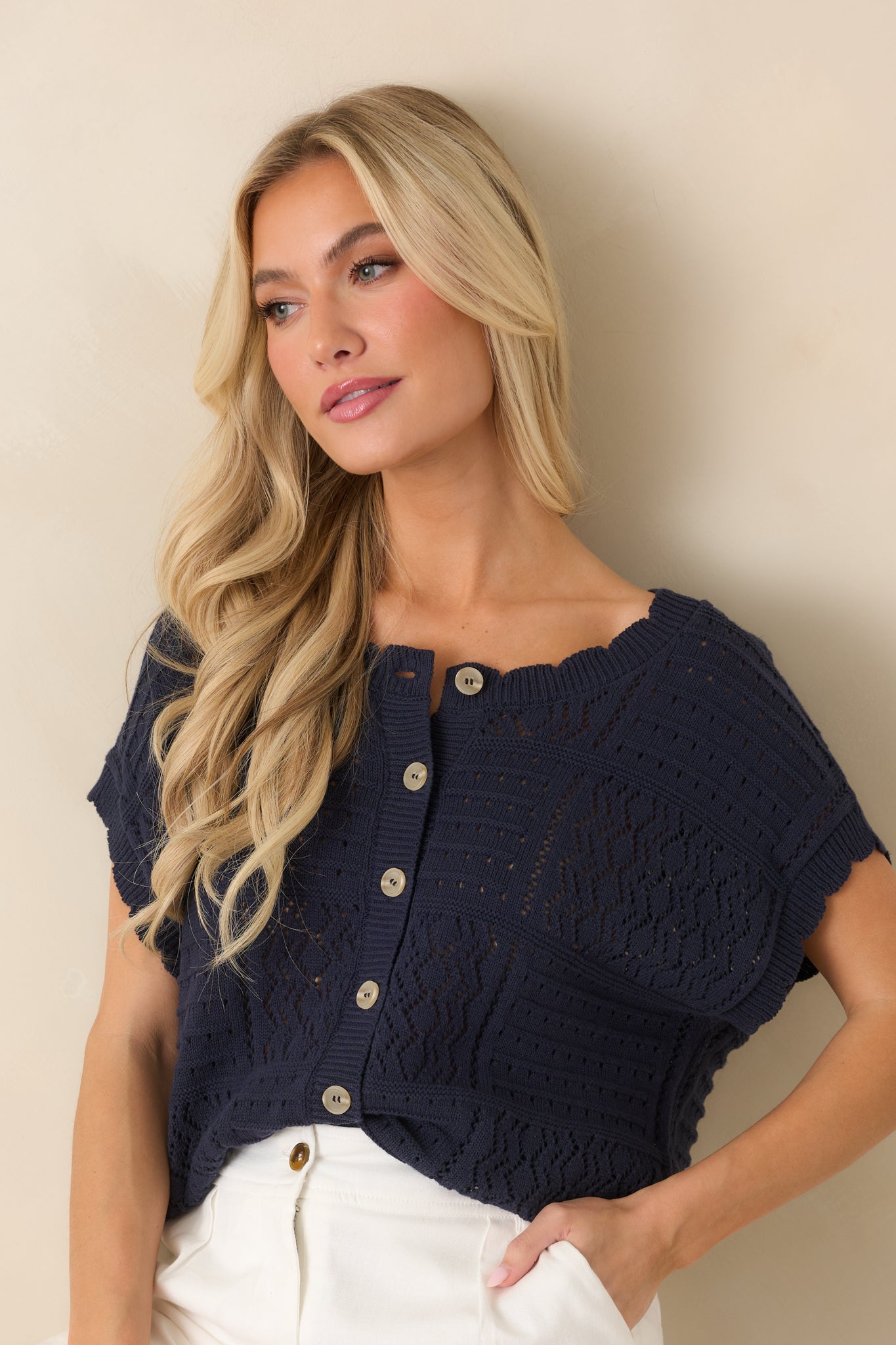 Close view of open-knit pattern showing breathable texture and dimensional stitch detail.