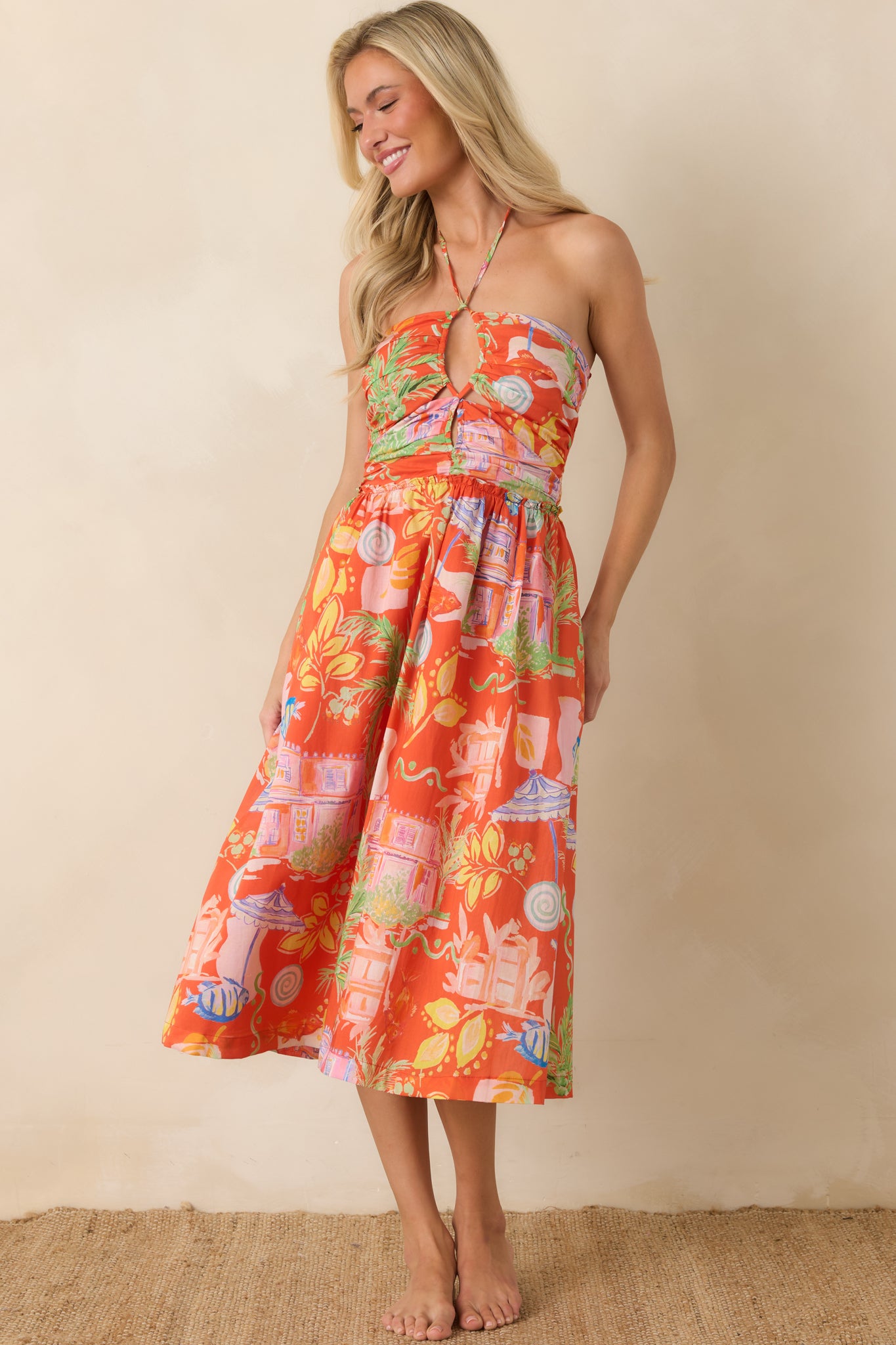 Halter-style midi dress with a smocked upper fit, side pockets, and airy tiered layers throughout the skirt.