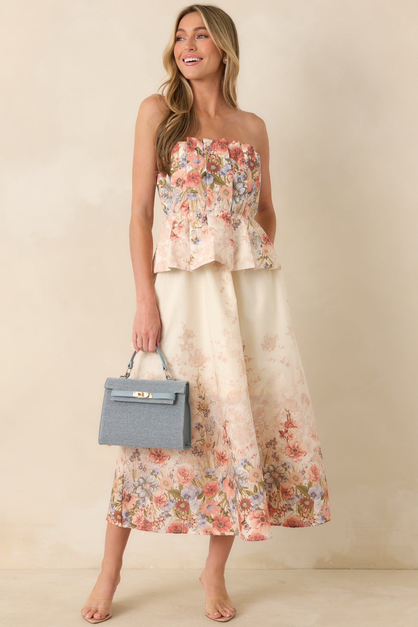 Pink multi floral cotton midi dress with strapless pleated bodice and smocked back panel.