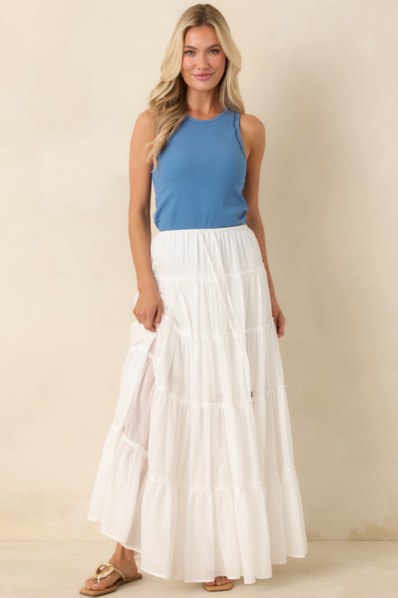 Sleeveless ribbed top with textured ladder trim and streamlined fit.