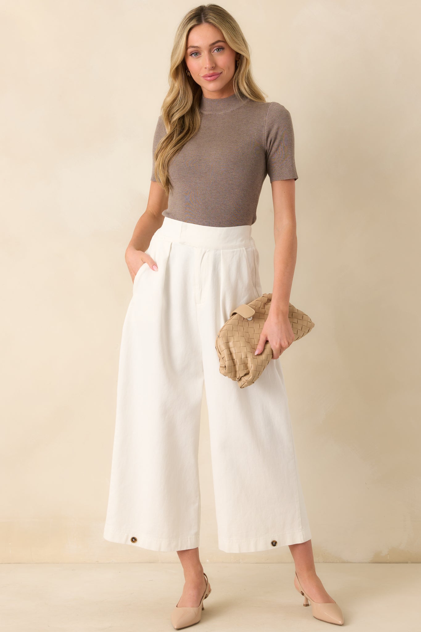 Full body front view of the high waisted pants showcasing the wide leg silhouette and tailored fit.