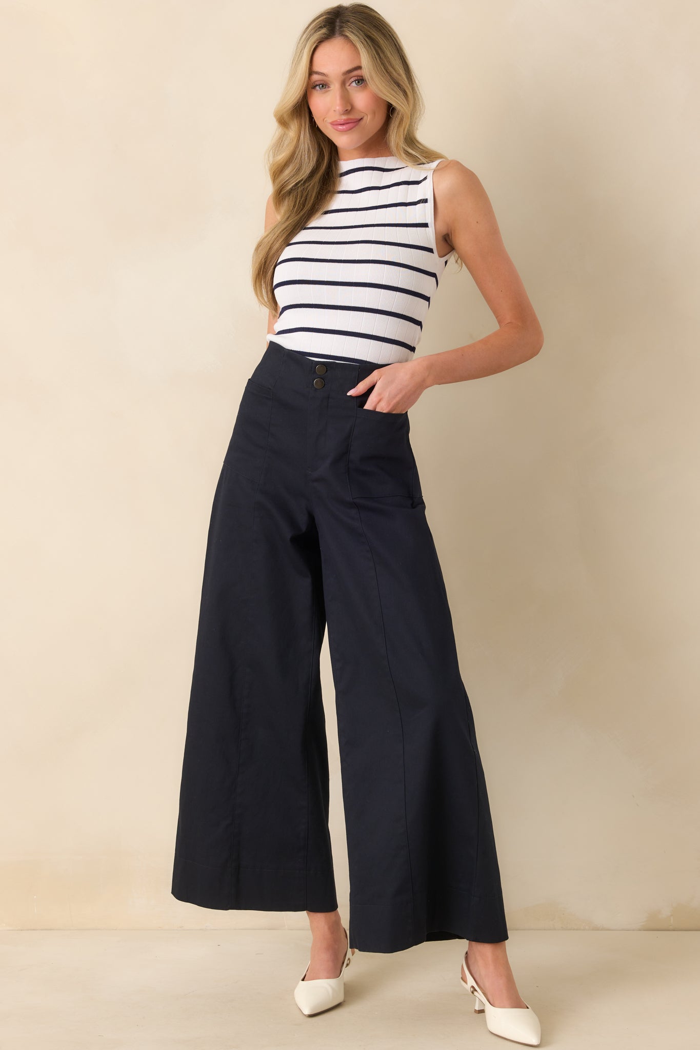 Front-facing full body shot emphasizing the length and relaxed drape of the wide leg design.