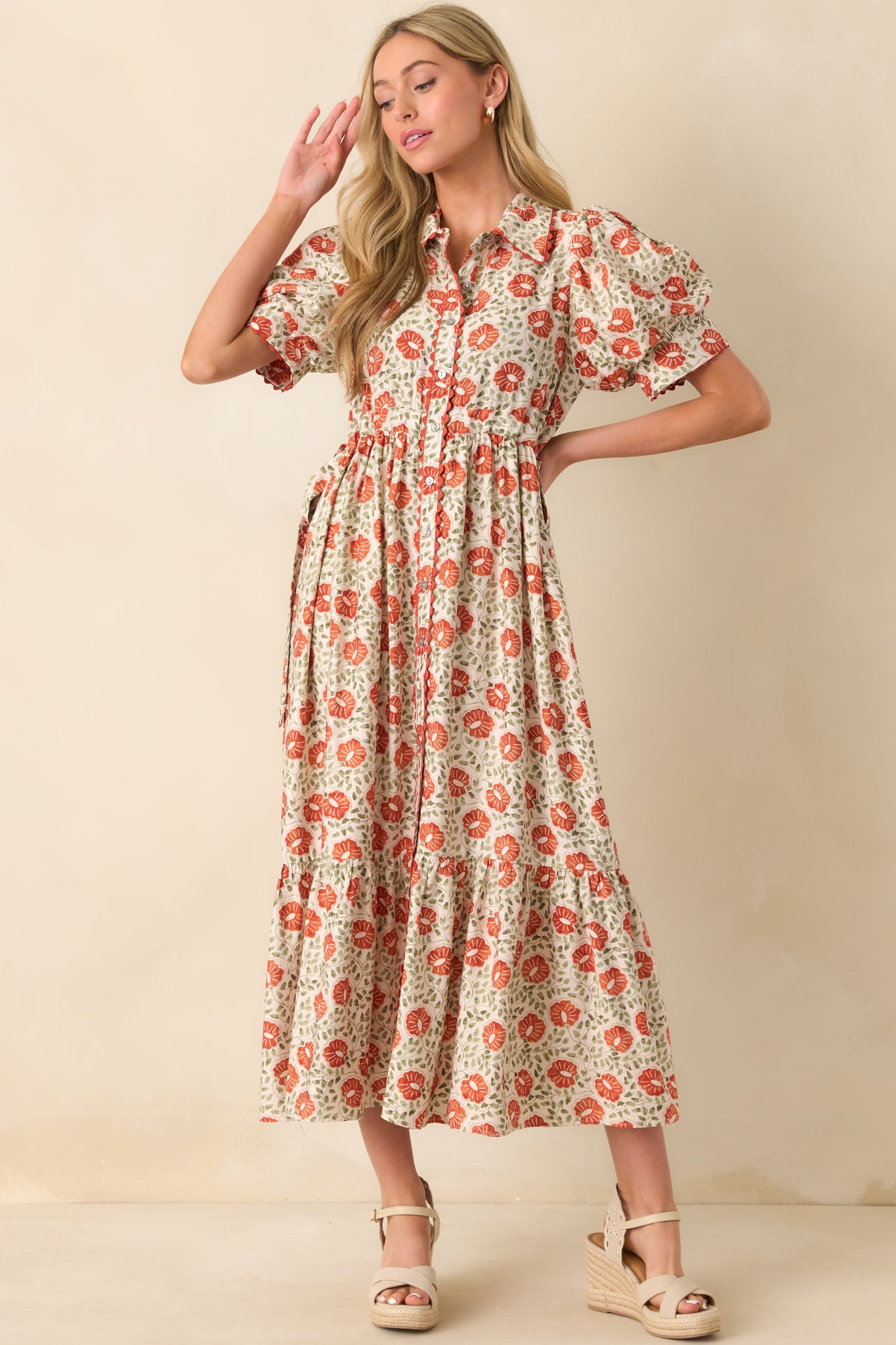 Full body view focusing on the adjustable waist self-ties at the sides.