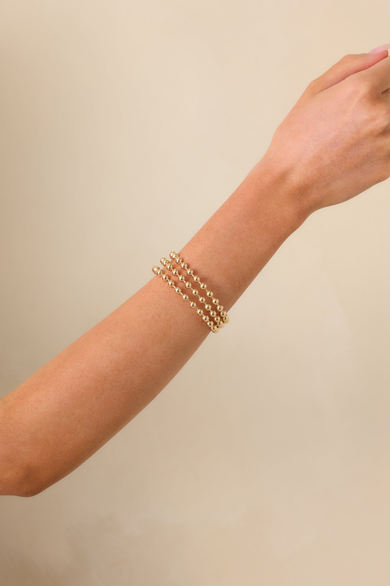 A cropped photo focusing on the curved form and sculptural balance of the ball prong accents.