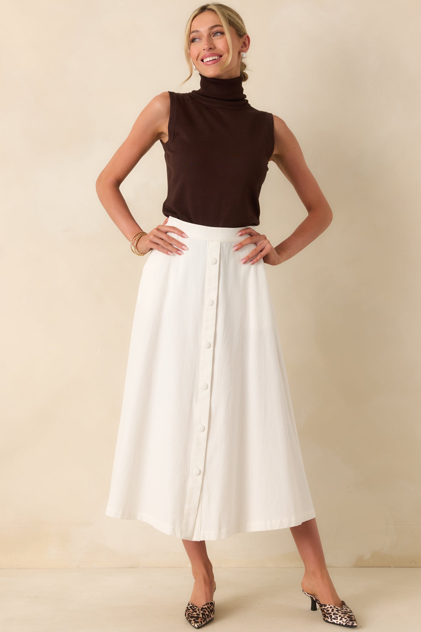 Full body side angle of the skirt emphasizing the smooth silhouette and flow of the fabric.