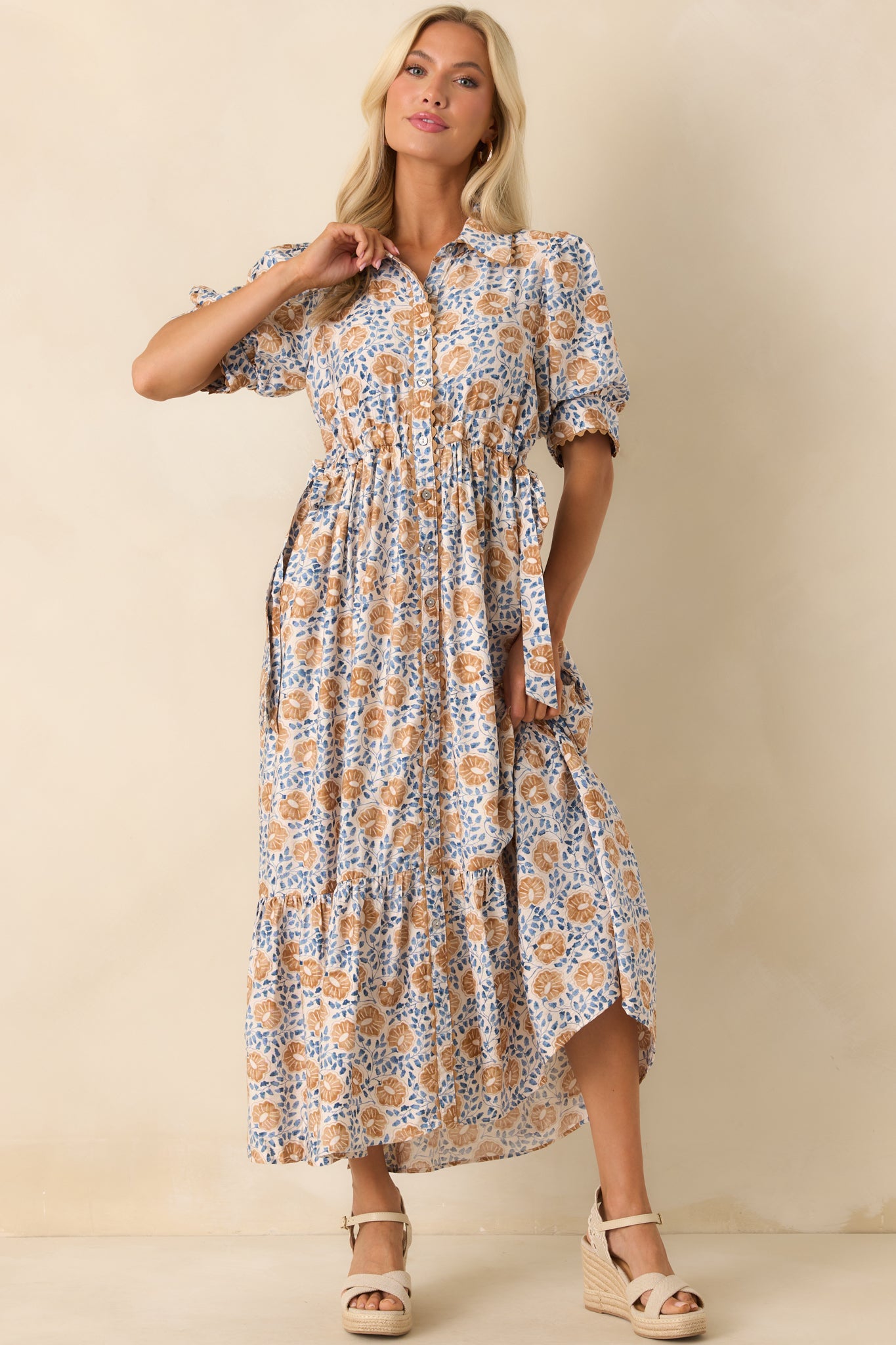 Honey yellow dress with a blue multi floral print, collared neckline, and button front closure shown in a full front view
