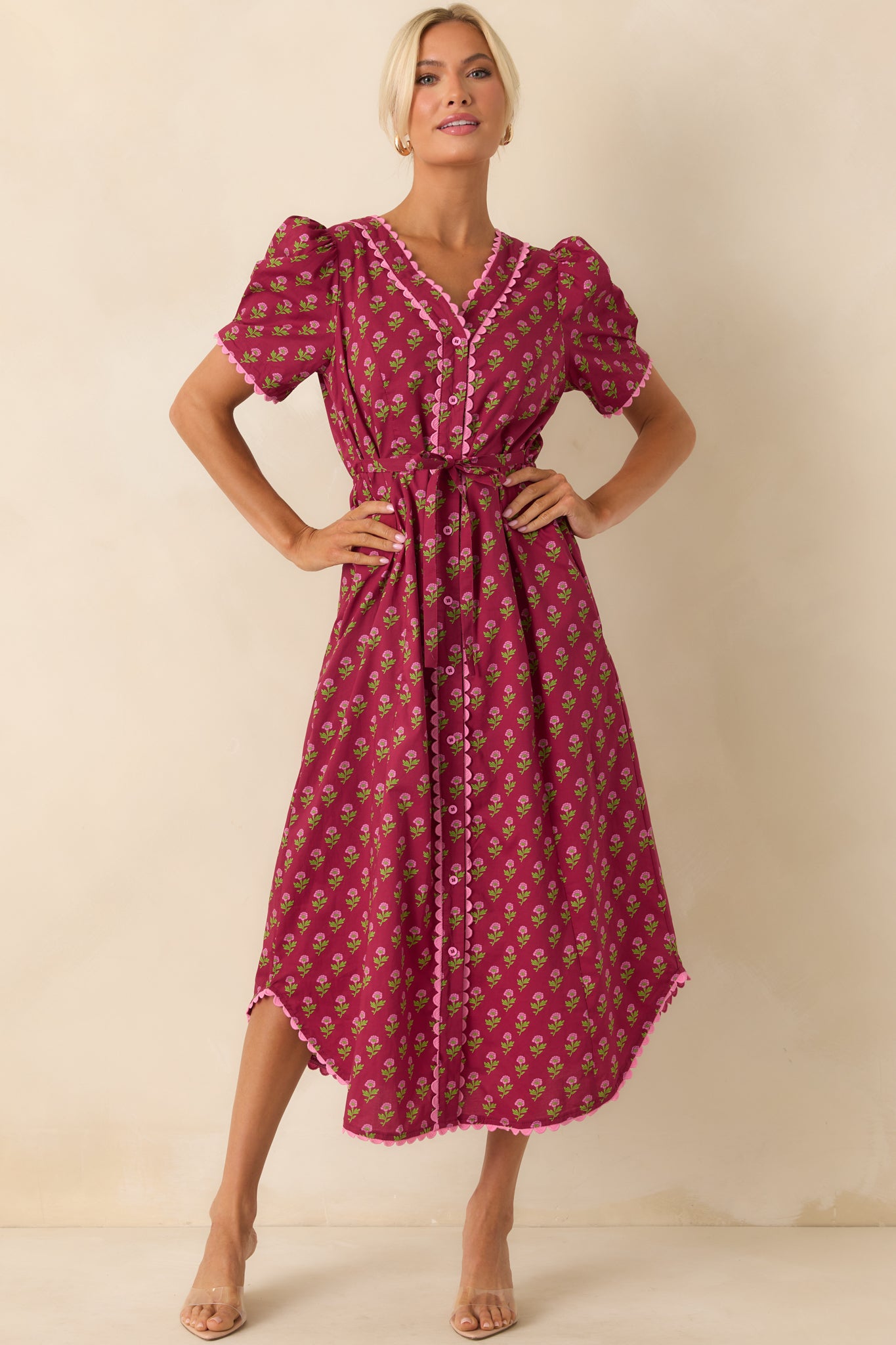 Front-facing image emphasizing the pink scallop trim detailing along the neckline and button placket.