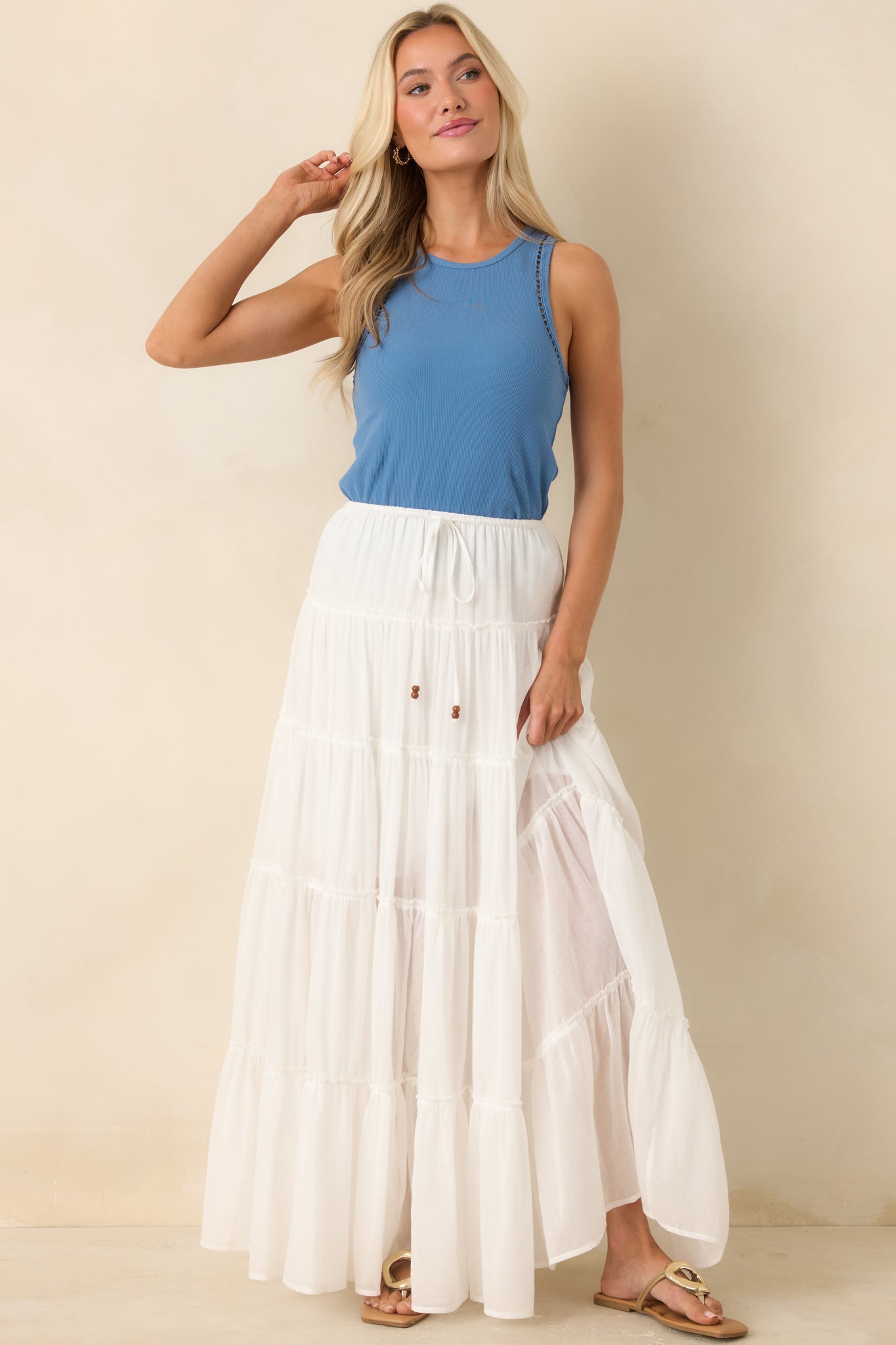 Tiered maxi skirt with breathable fabric and adjustable waistband detail.