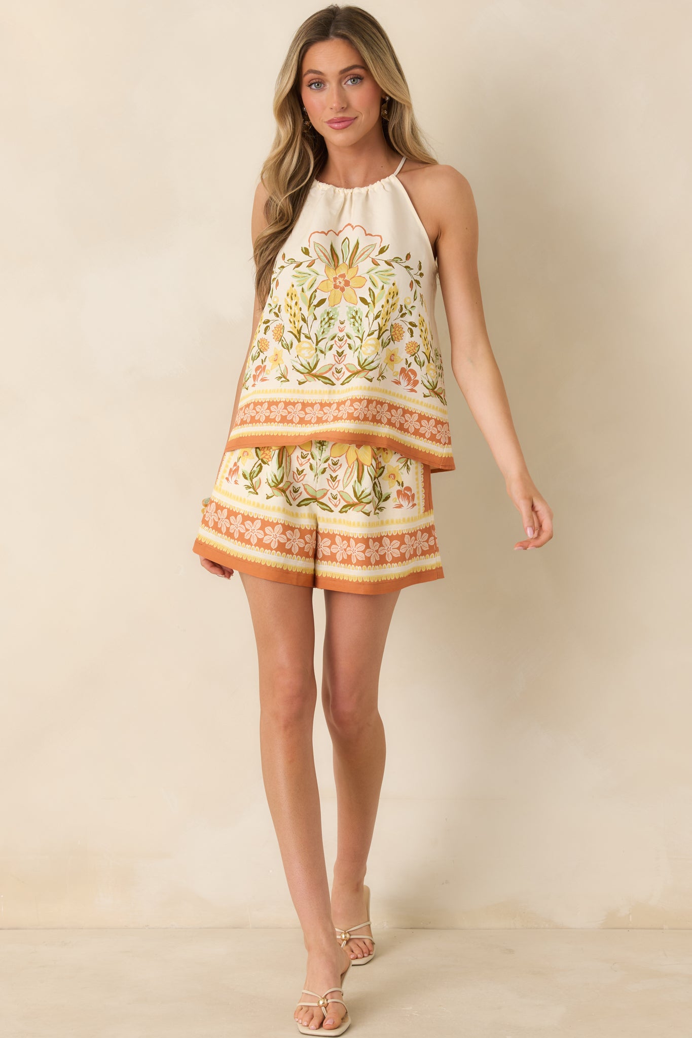 Breezy shorts with colorful floral border print and relaxed fit.