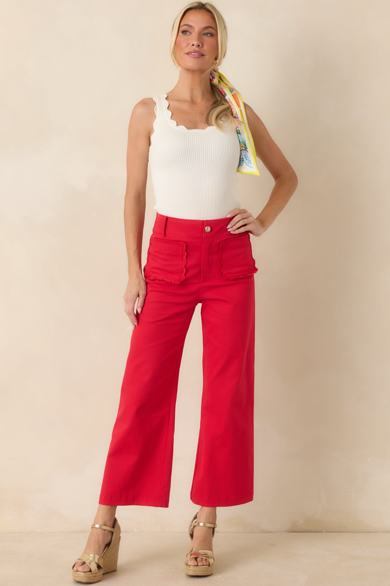 Bold red cotton pants with a structured high-rise fit, belt loops, and a clean wide-leg shape.