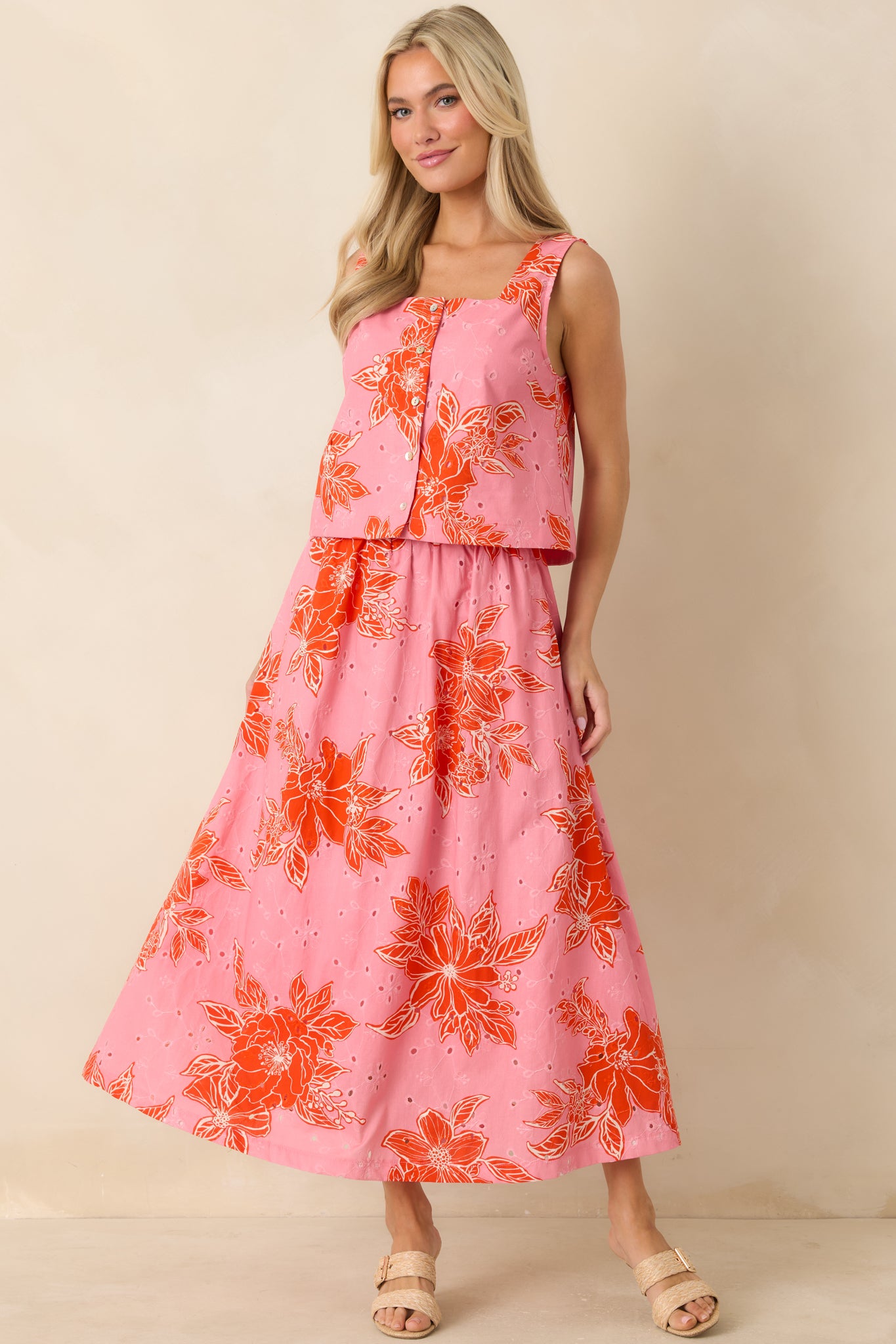 Pink and red floral cotton eyelet midi skirt with elasticized waistband and relaxed flow.