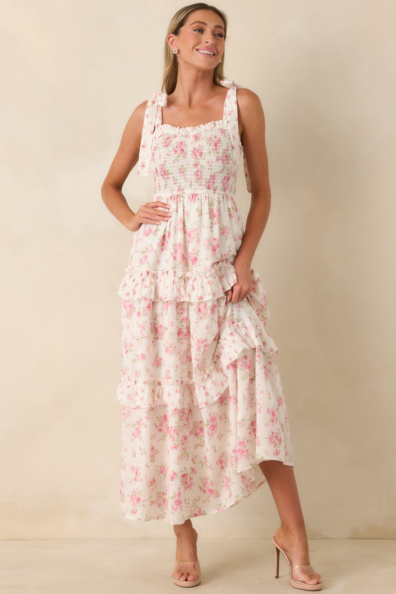 Floral tiered maxi dress with a sweetheart neckline, softly gathered ruffle skirt, adjustable tie straps, and breathable cotton fabric.