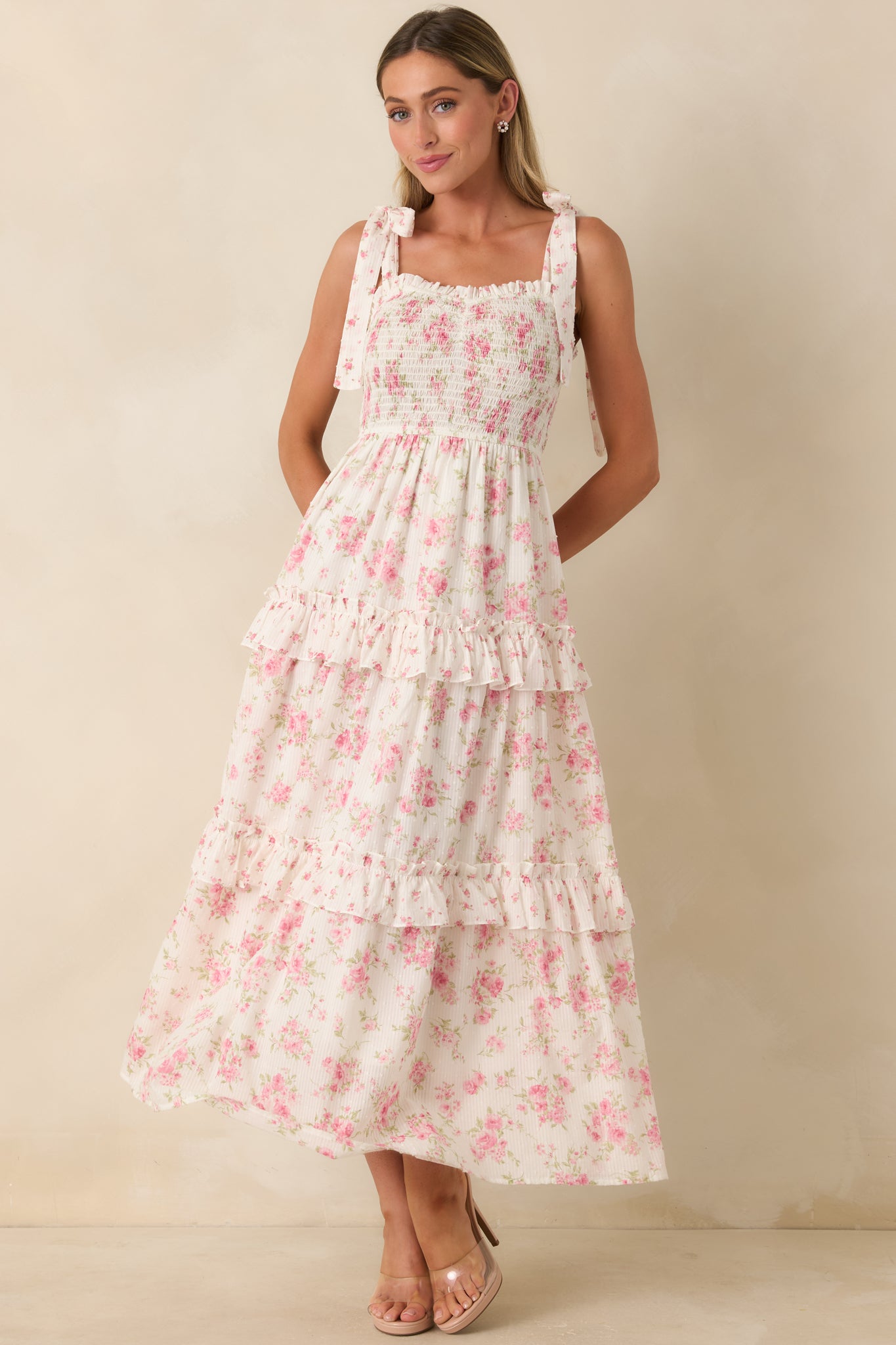 Swiss dot floral maxi dress with a smocked bodice, layered ruffle tiers, delicate floral print, and an easy flowing silhouette.