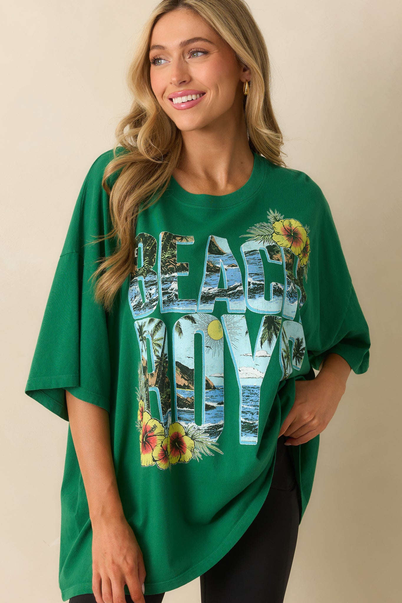 Cropped shot highlighting the crew neckline and soft green fabric of the tee.