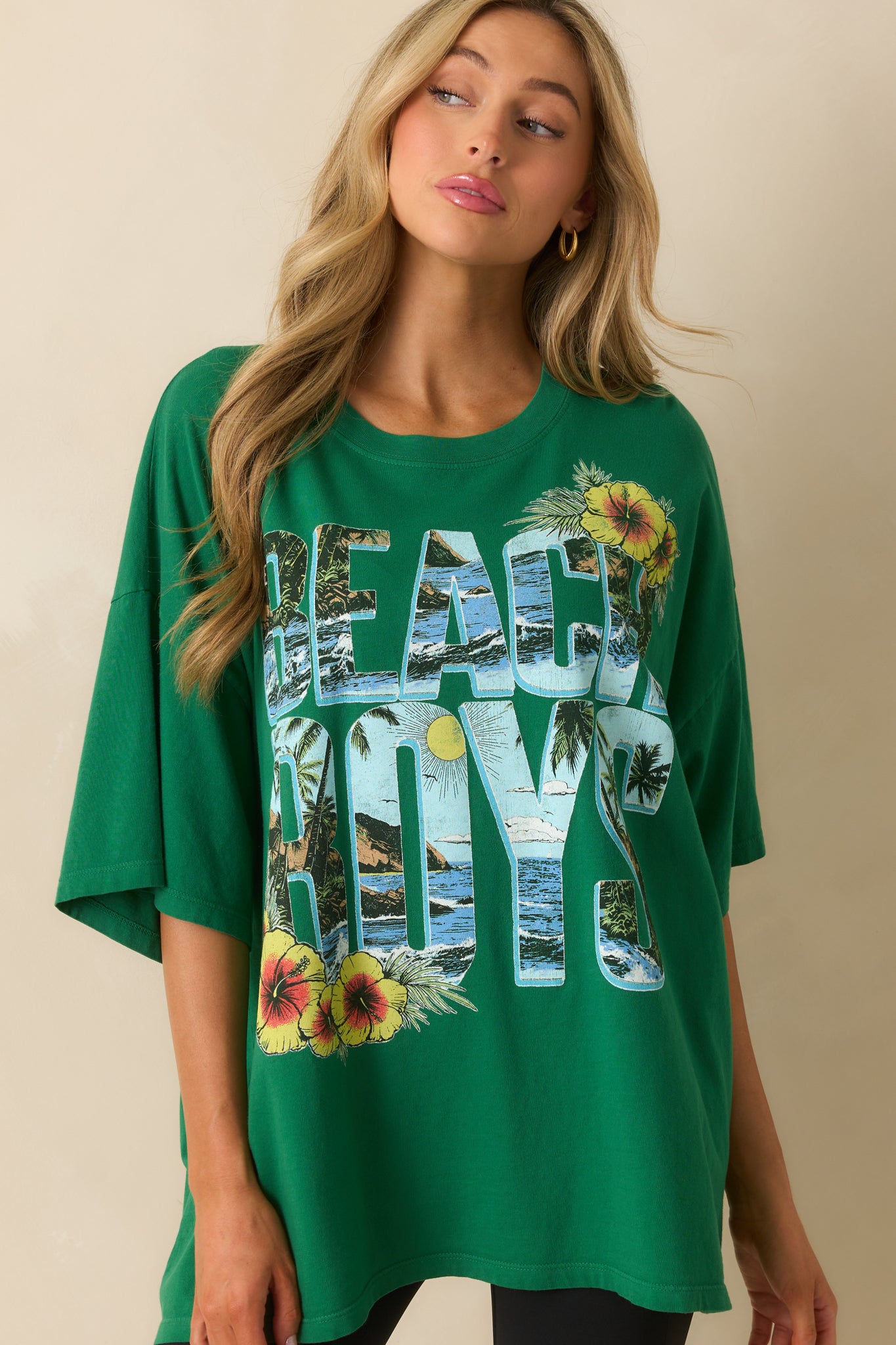 Cropped image emphasizing the short sleeves and oversized drape.