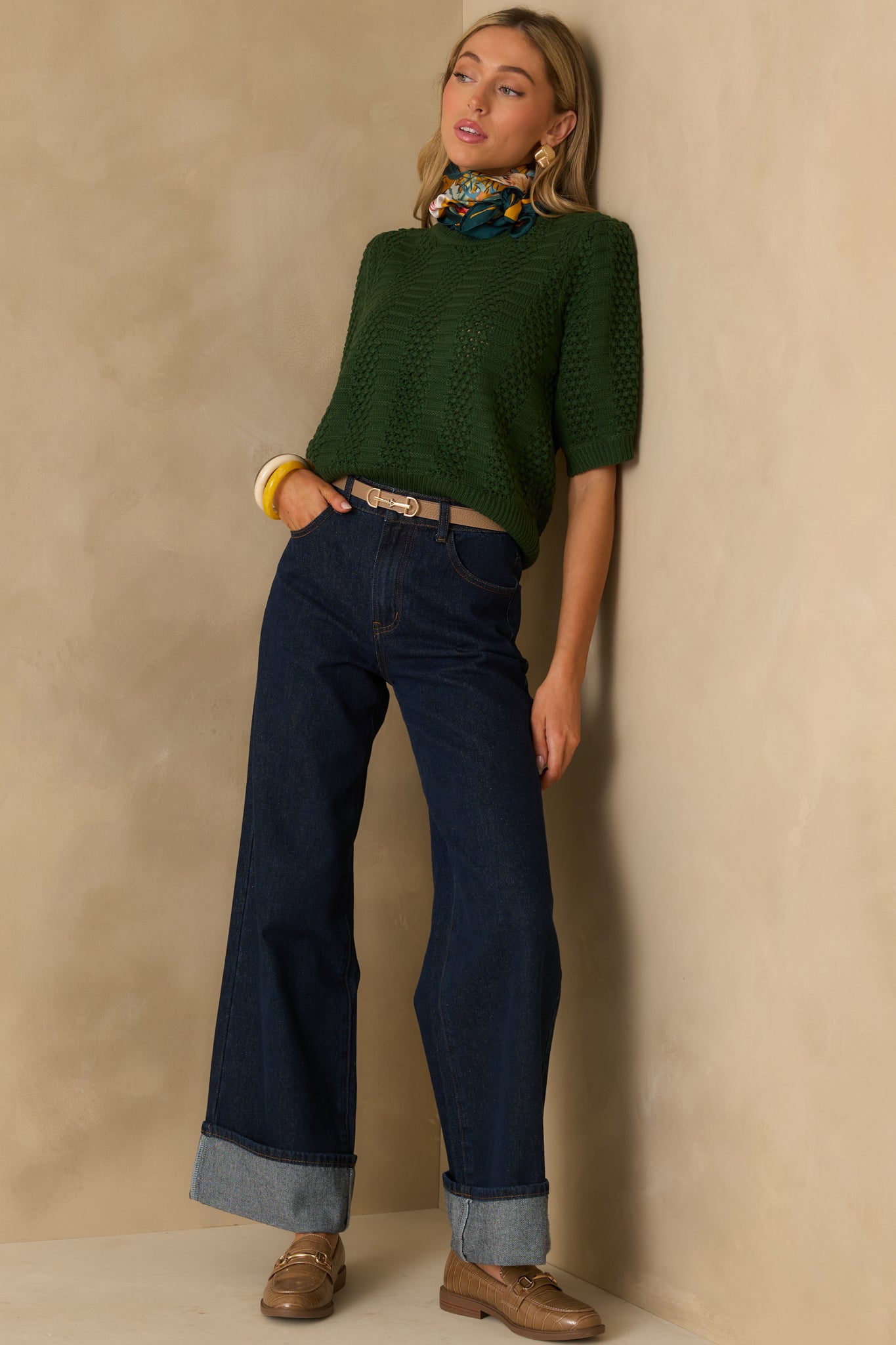 Full length shot highlighting the structured short sleeves and contrast between the open crochet and ribbed knit panels.