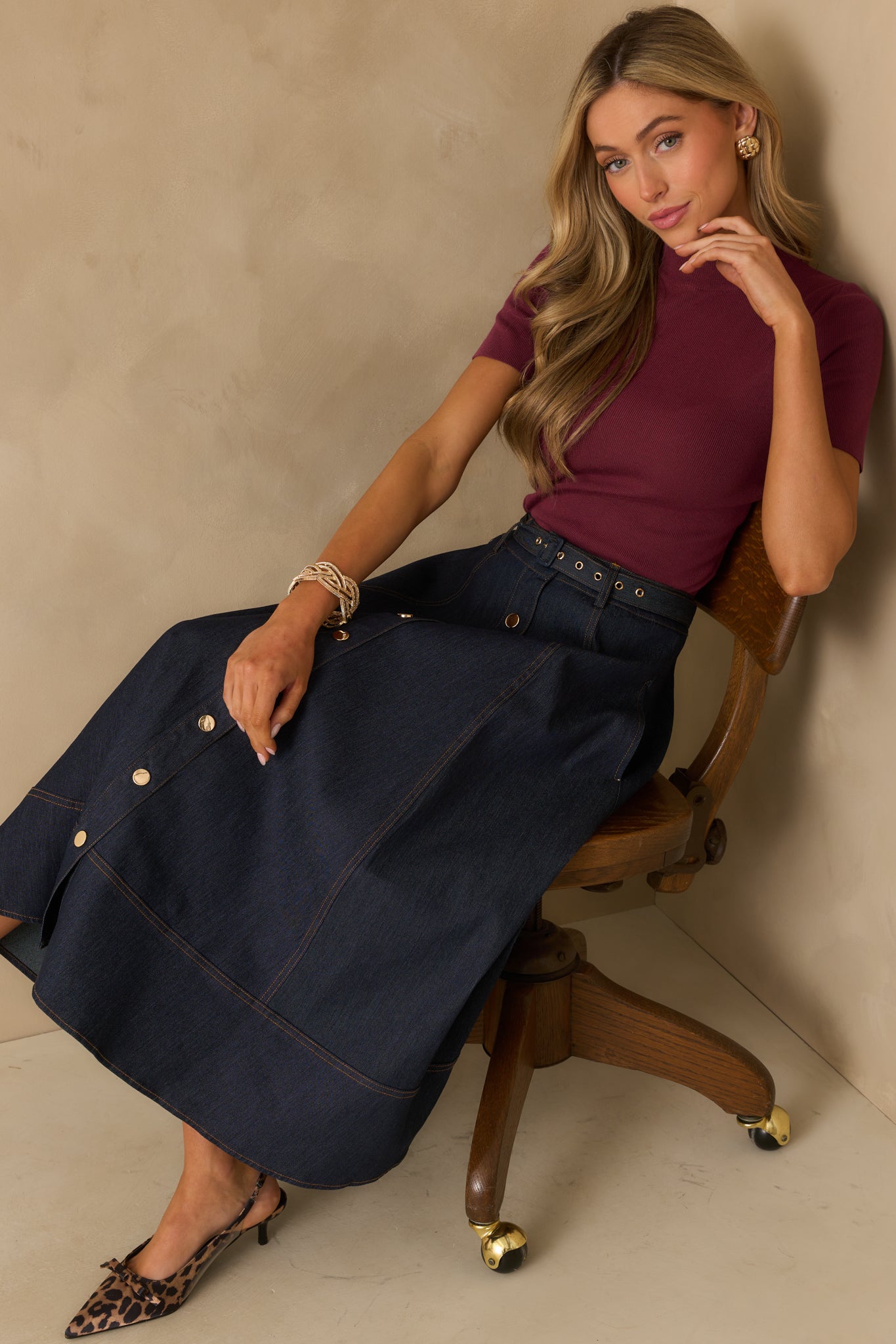 A complete profile of the wine red top shown fully styled, featuring a mock neckline and short sleeves.