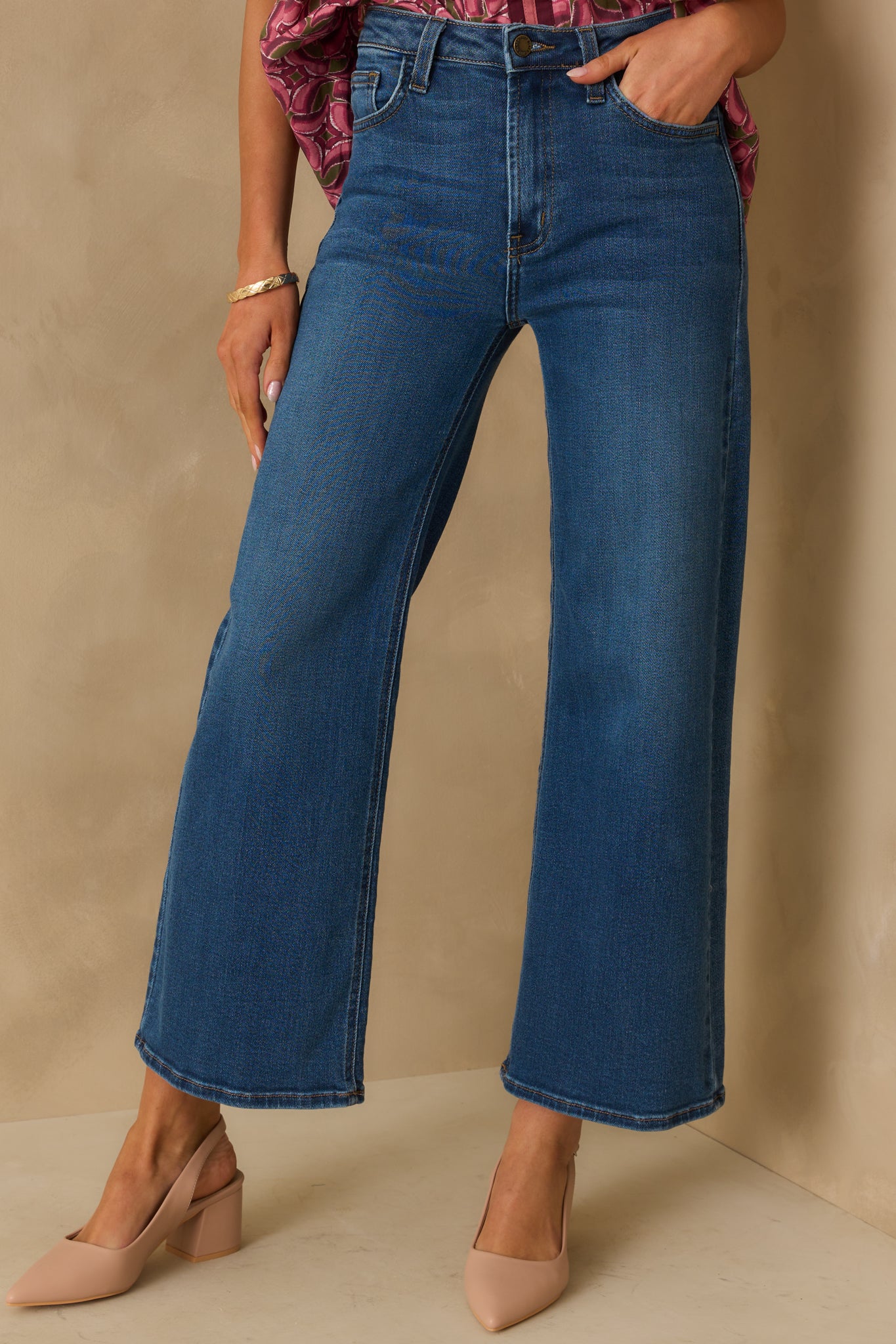 Cropped front view focusing on the waistband with belt loops and functional front pockets.