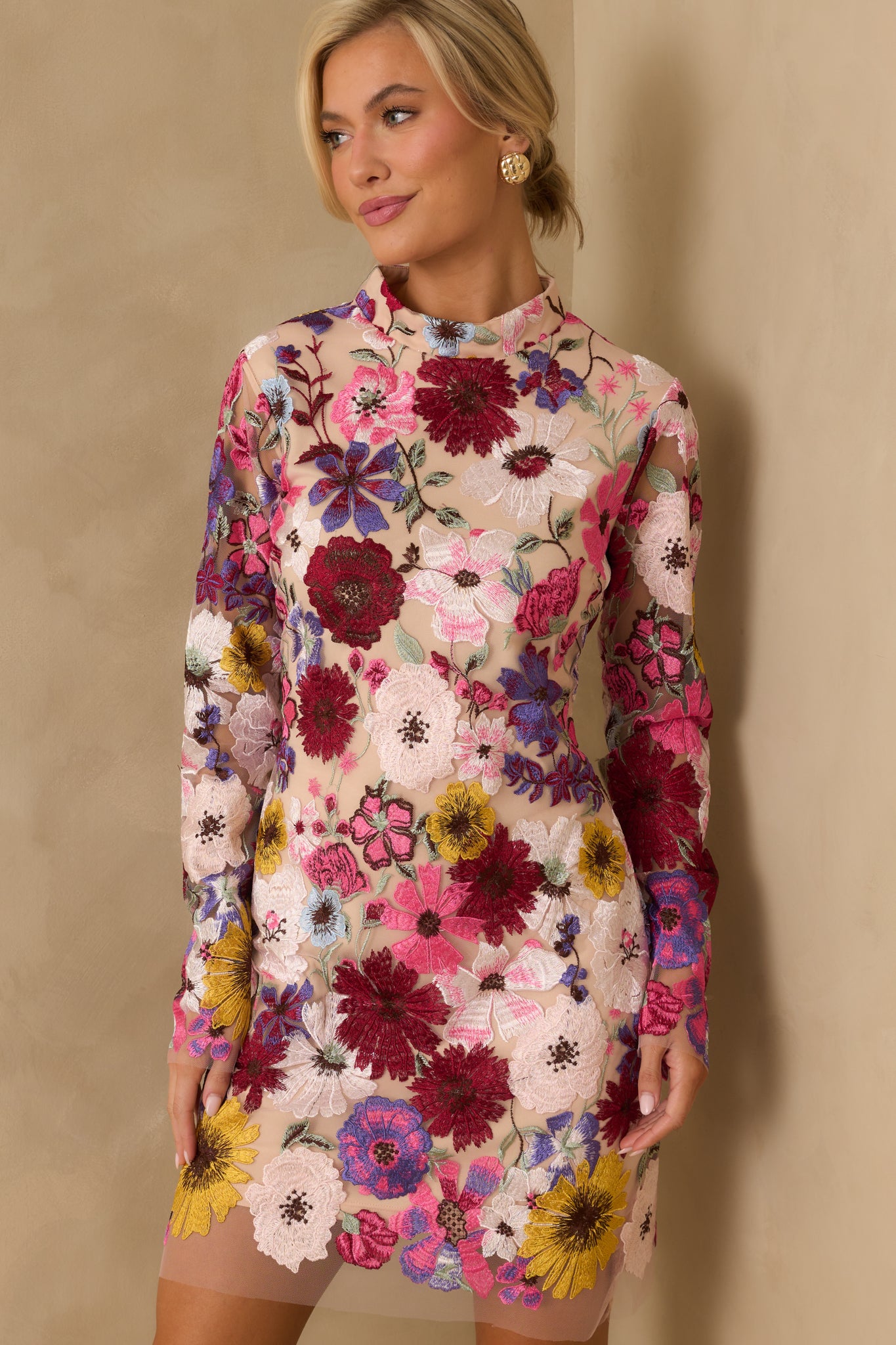 Cropped view focusing on the high neckline and sheer floral overlay.