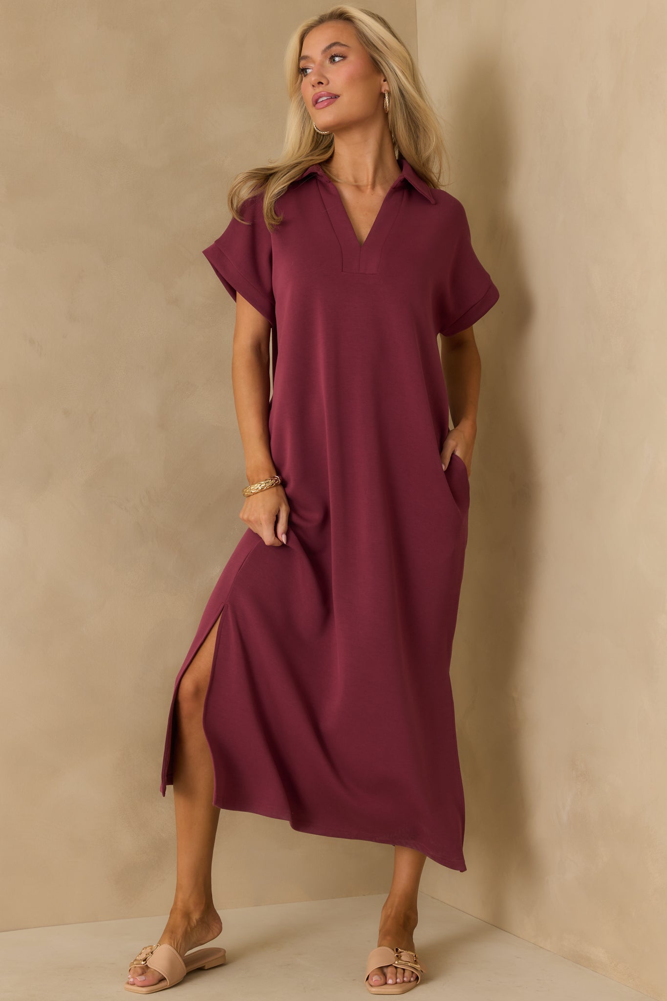 Relaxed fit midi dress in soft burgundy fabric with functional pockets.