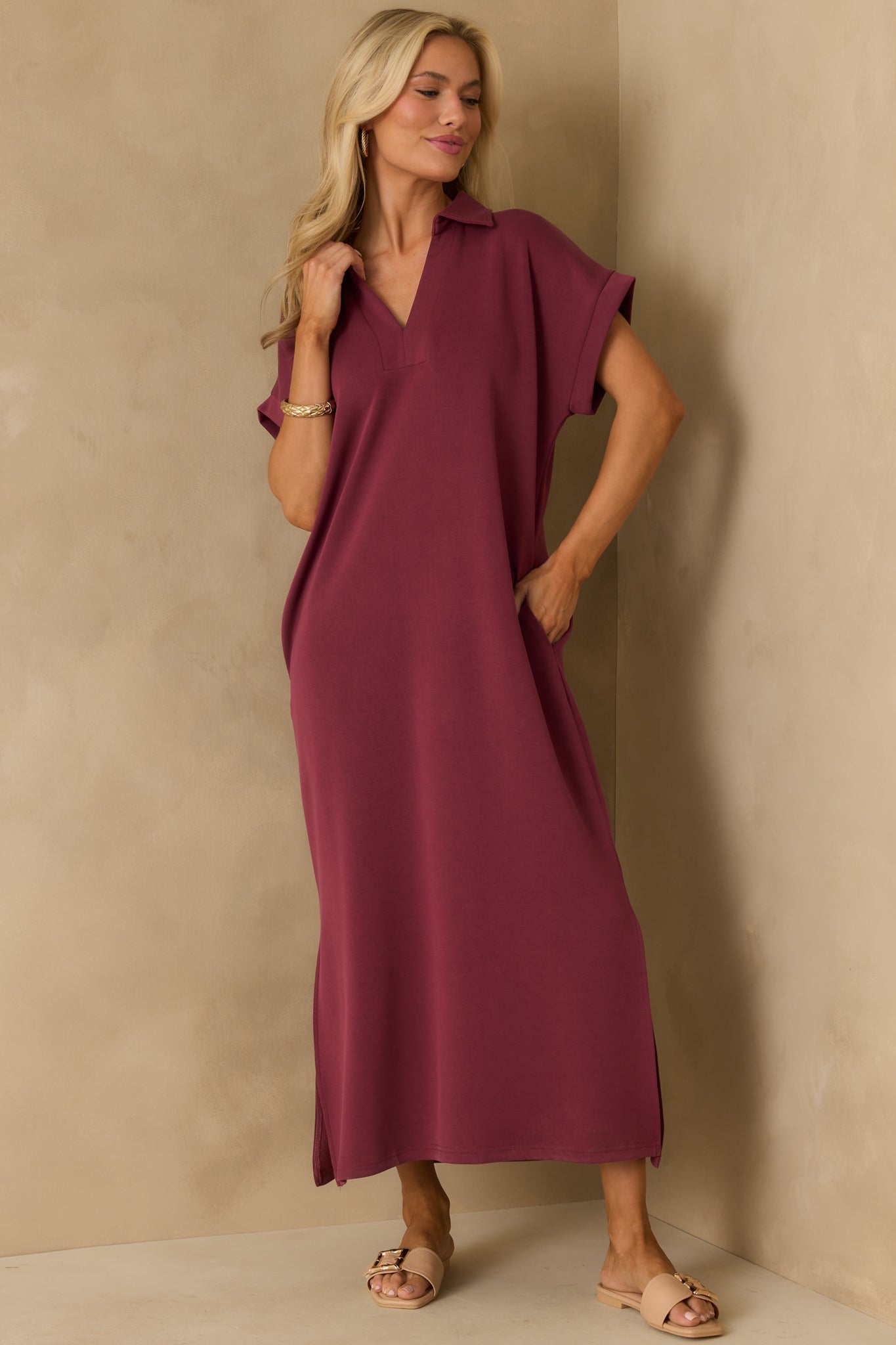 Burgundy midi dress with a collared notch v-neckline and short sleeves.
