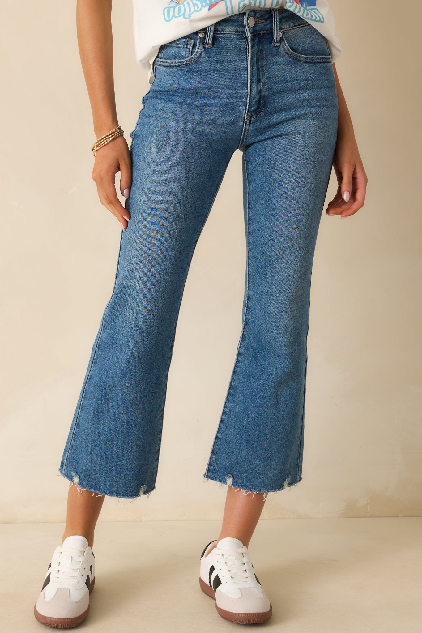 Cropped image highlighting the high rise fit and front pocket detailing.