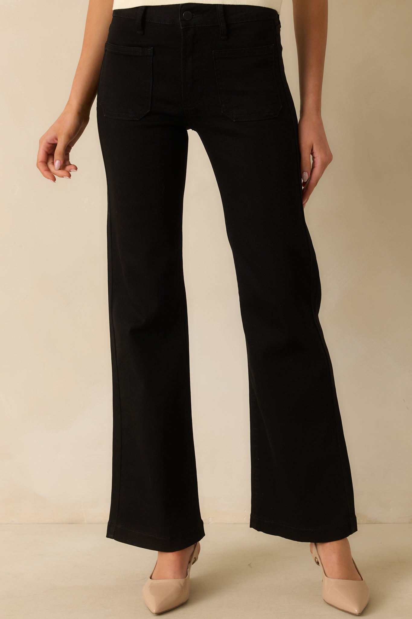 Front cropped view focusing on flare leg shape, pocket placement, and denim texture.