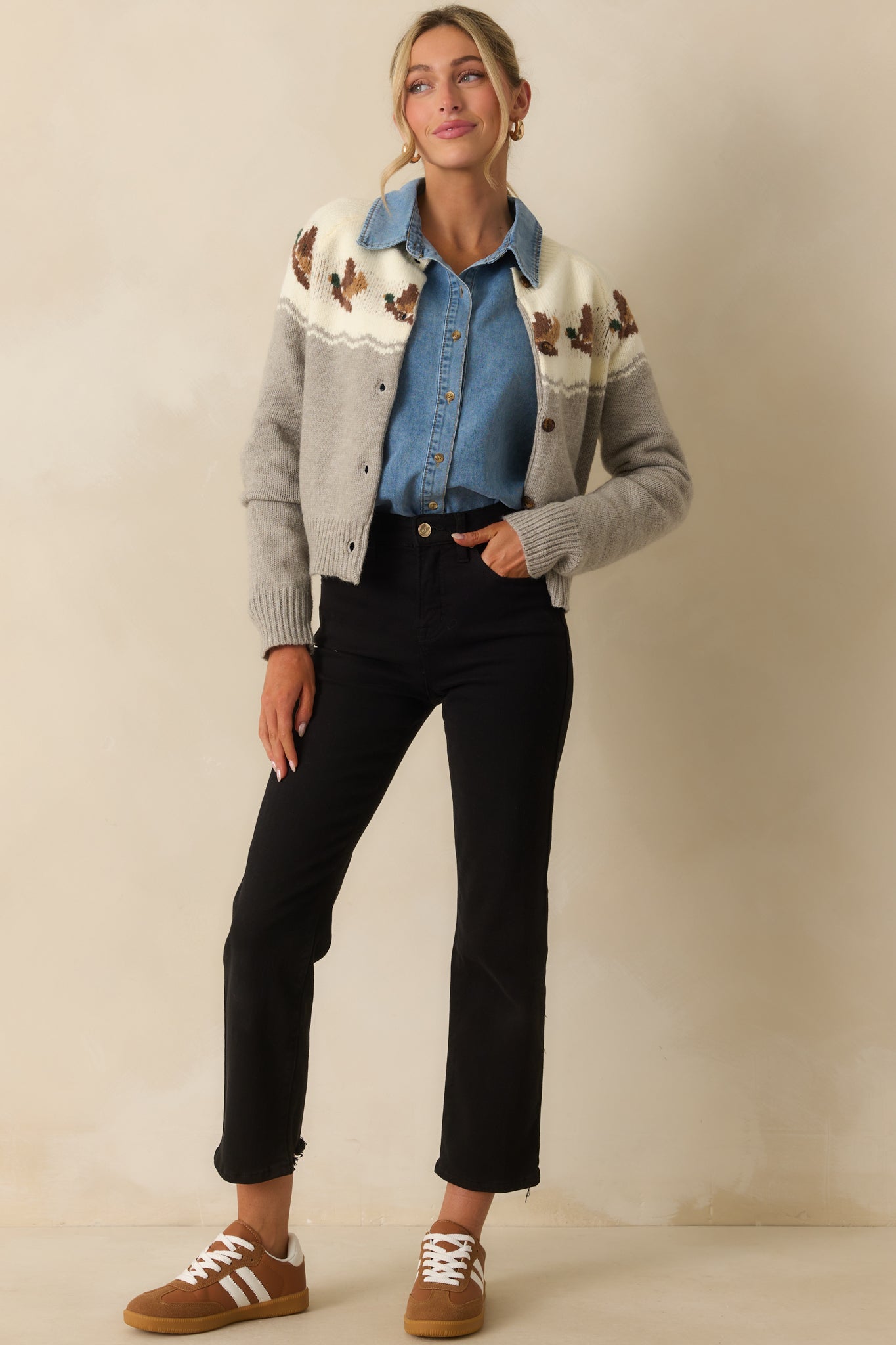 Grey and ivory knit cardigan with intarsia ducks and a relaxed button-up fit.